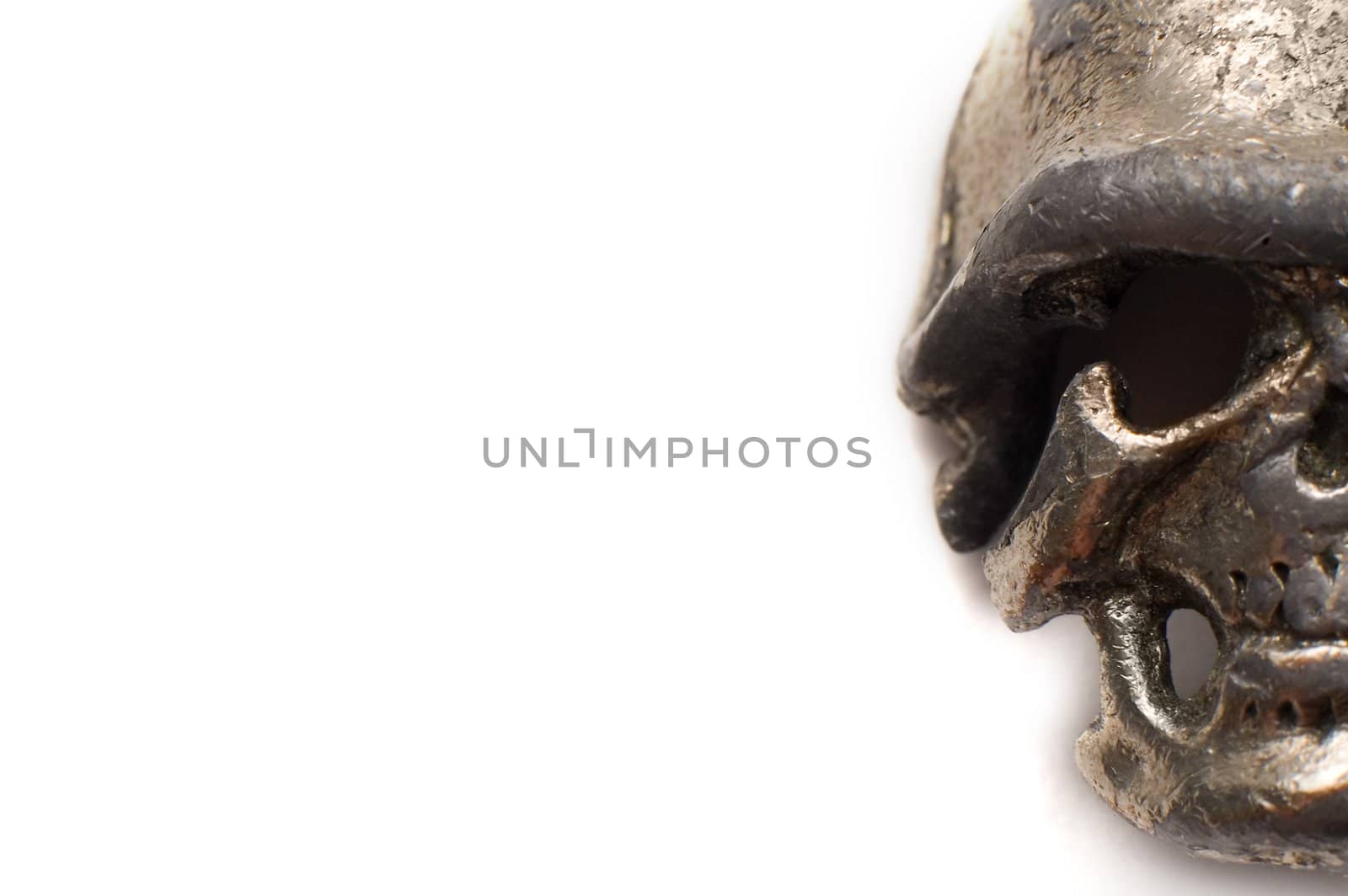 small metal skull detail isolated on white background