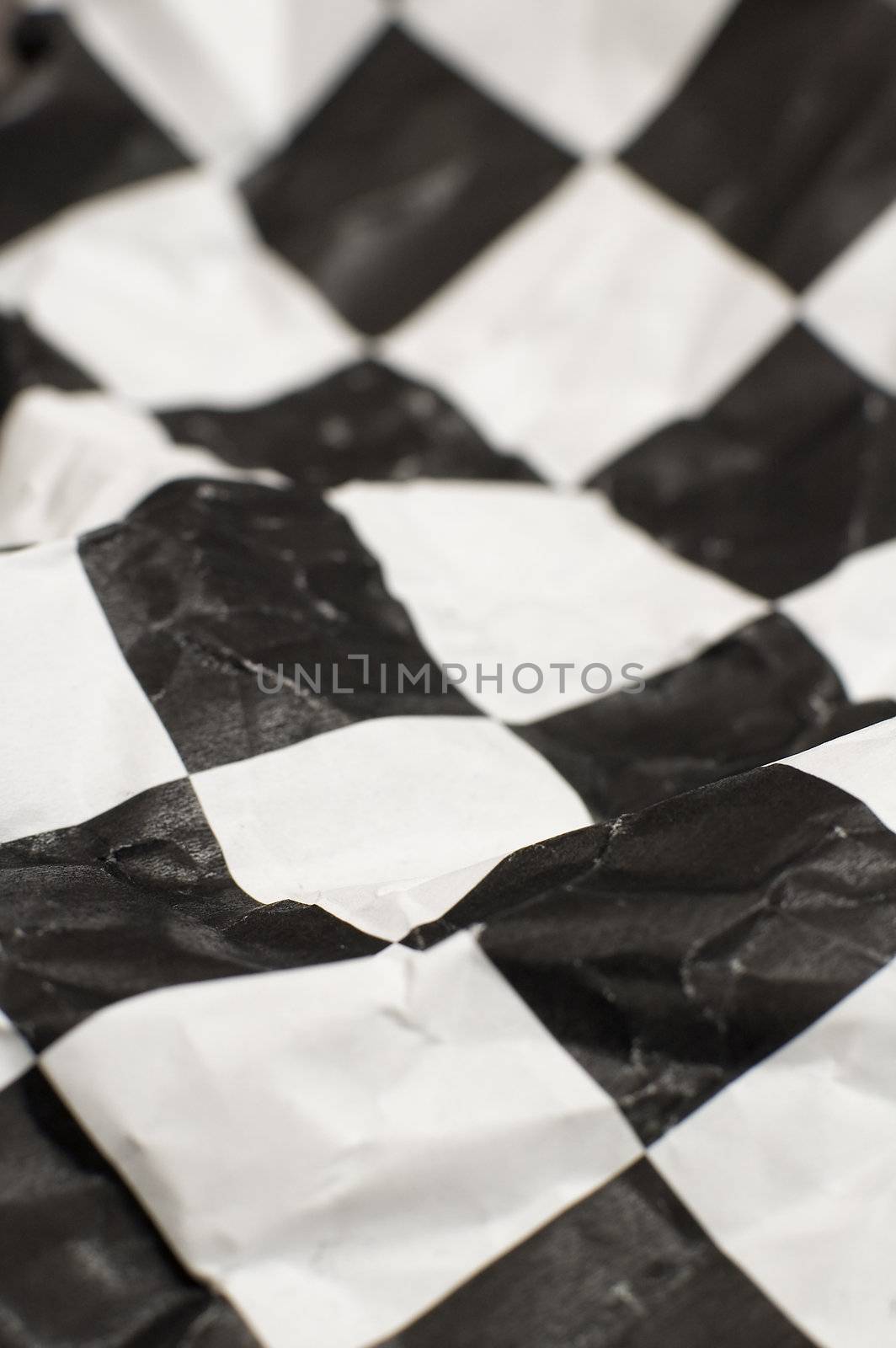 wrinlked checkered race flag, shallow depth of view
