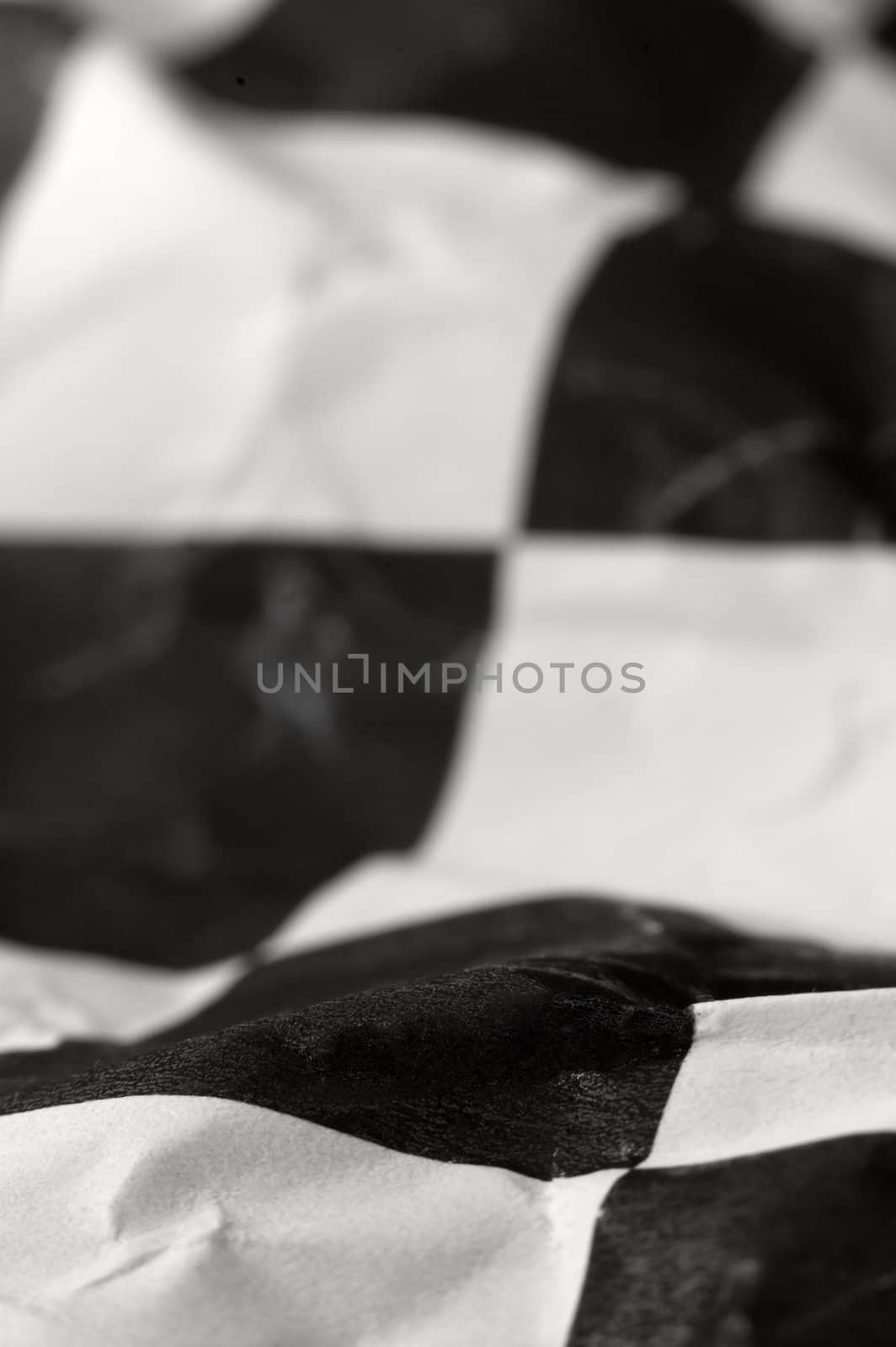 wrinlked checkered race flag, shallow depth of view