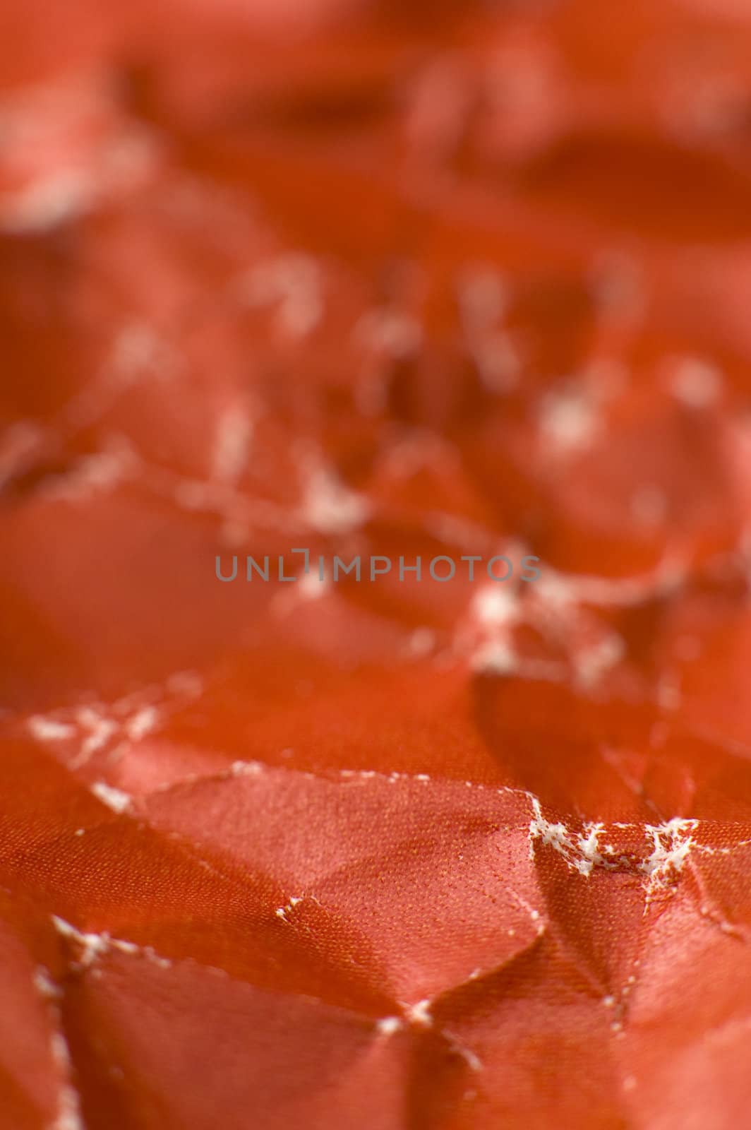 red wrinkled paper background, shallow depth of view 