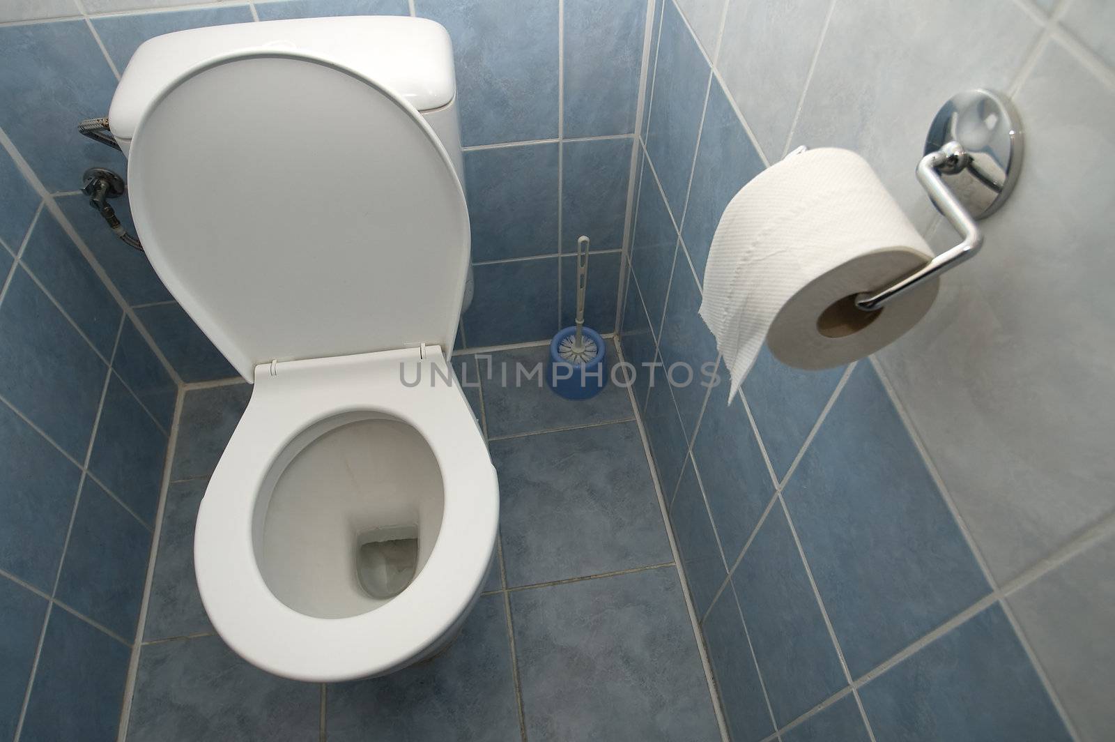 clean toilet interior, tiled walls and floor