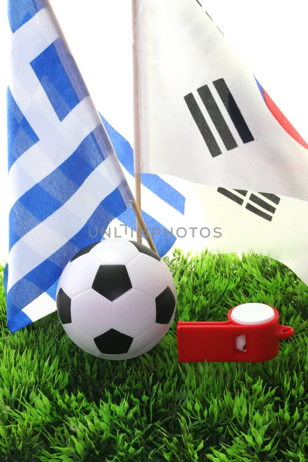 Flags with leather ball and whistle on a white background