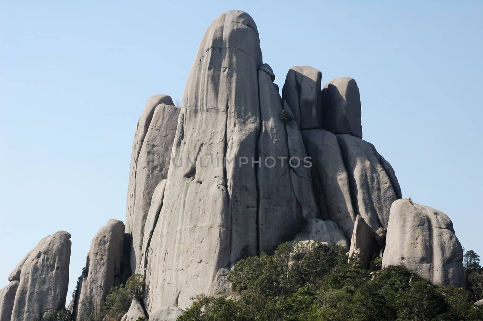 Landscape of rocky mountains with blue sky as background