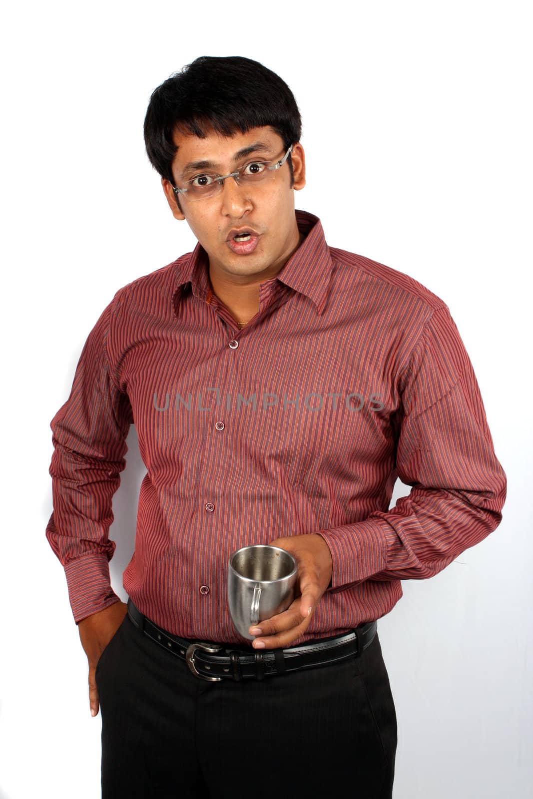 A portrait of a surprised Indian man, on white background.
