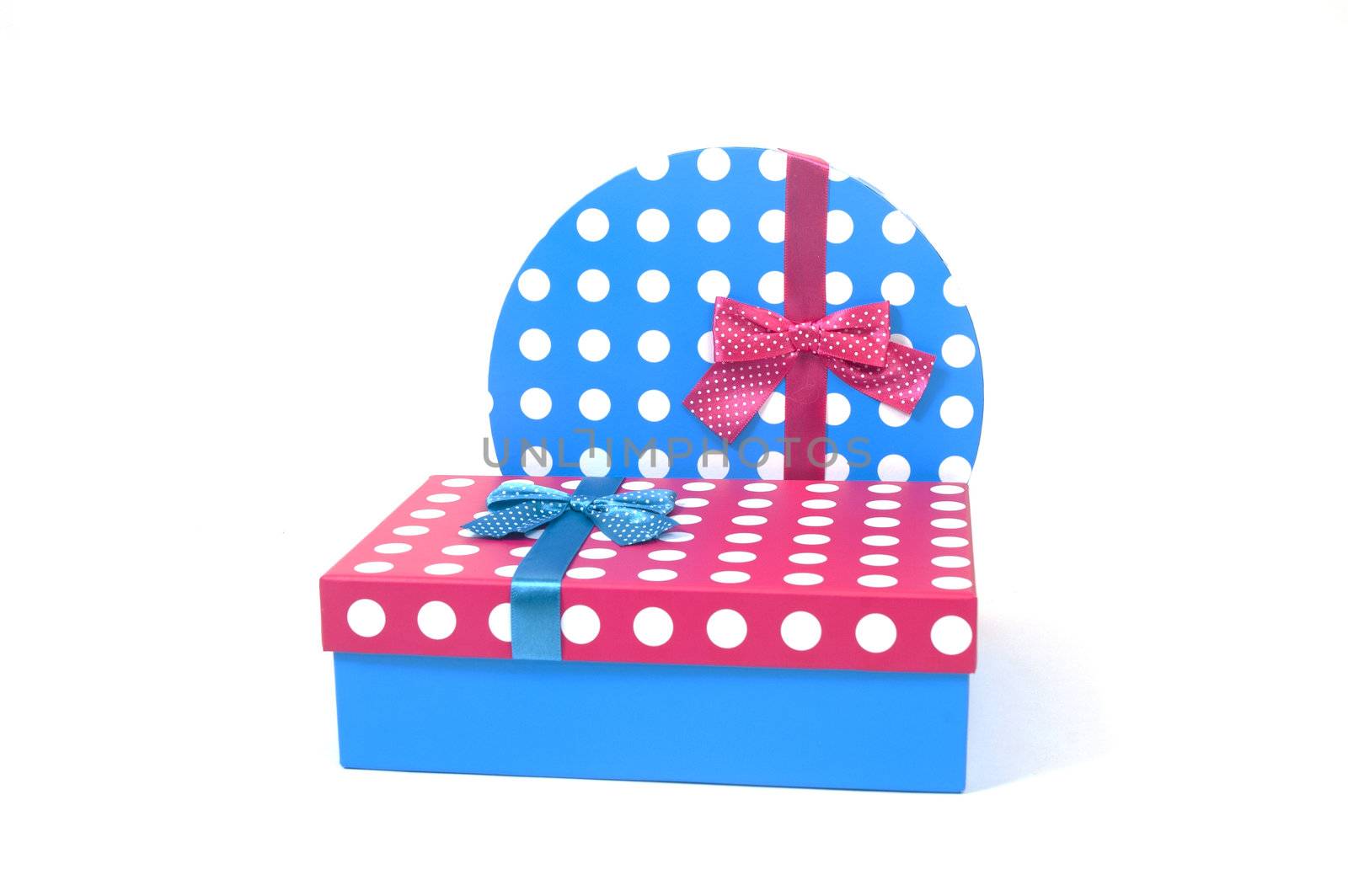 two present decorated with dots and bows isolated on white