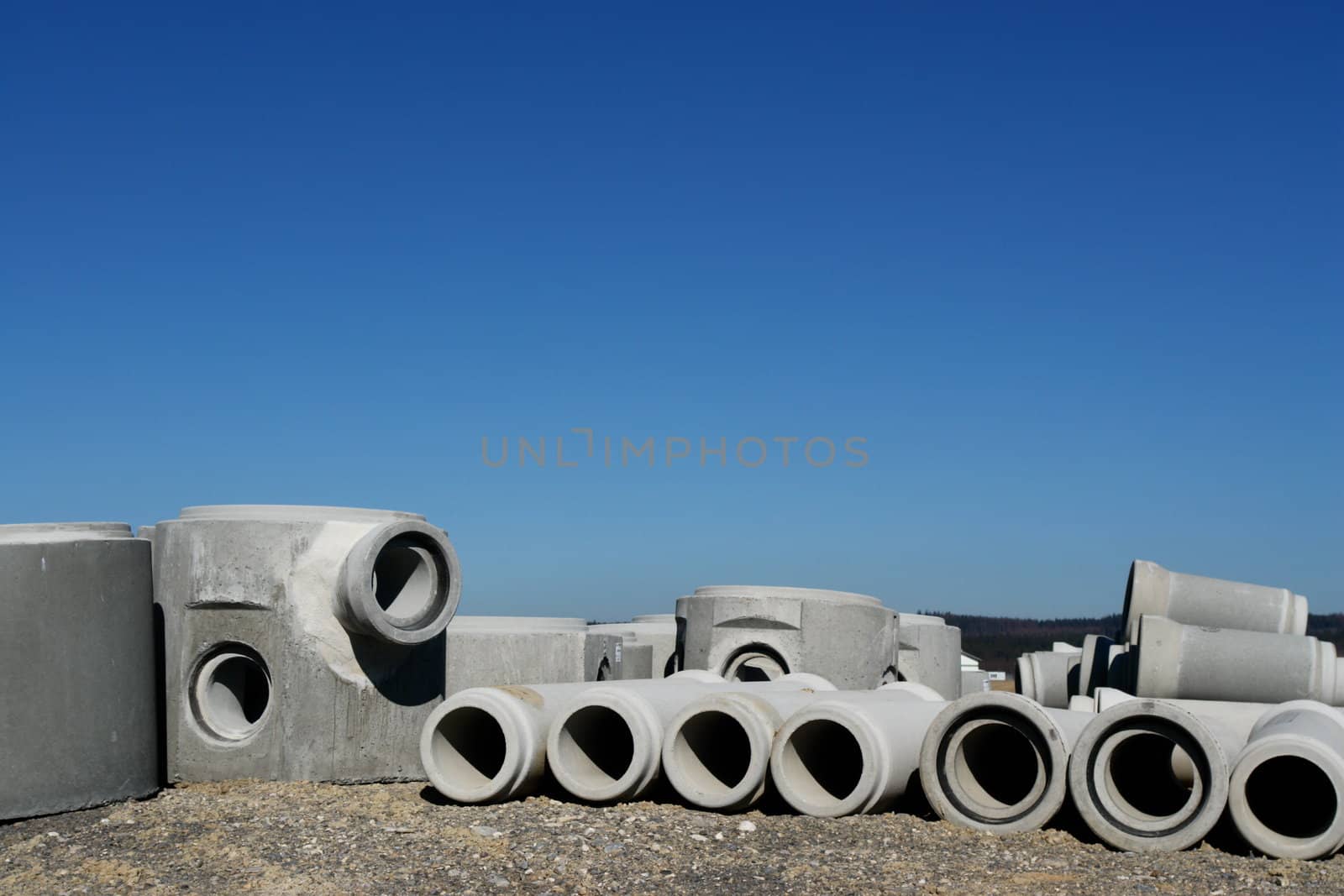 concrete pipes on a building site on a sunny day