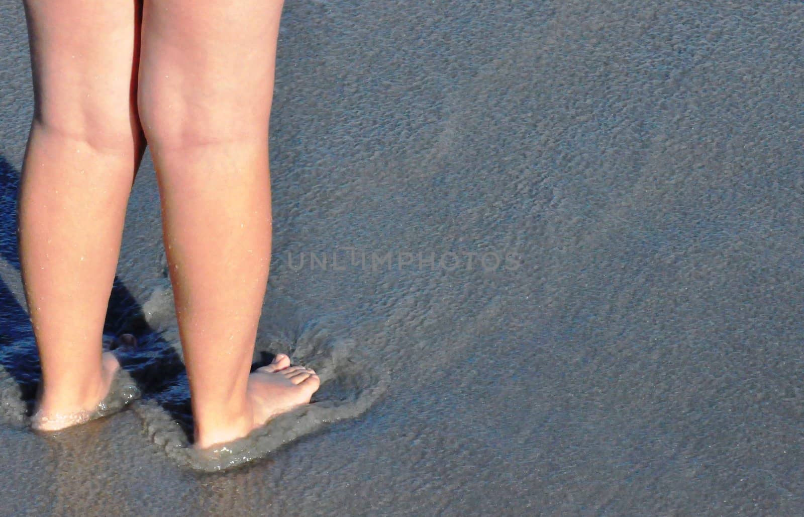 Feet in the sand by RefocusPhoto