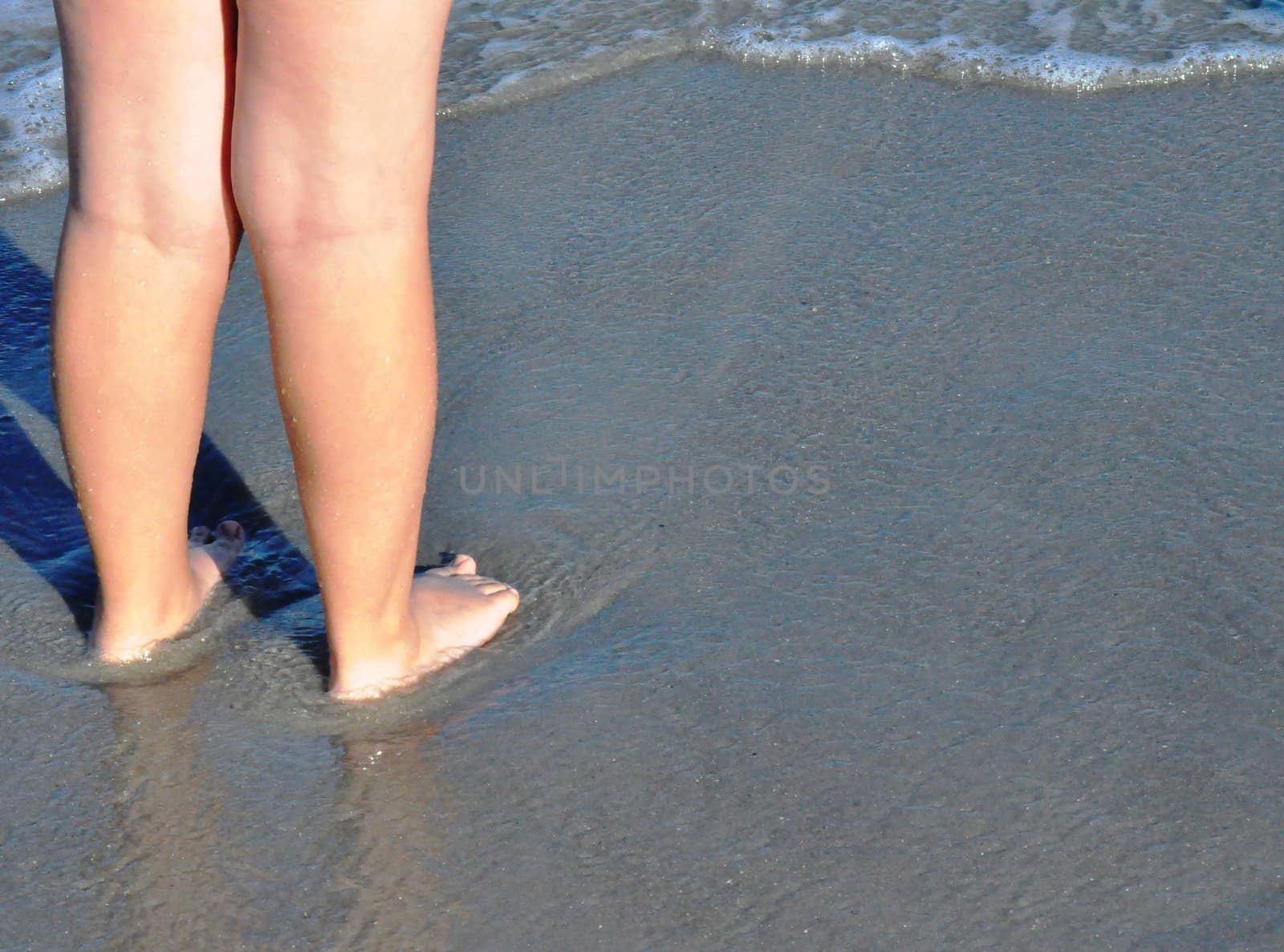 Feet in the sand by RefocusPhoto
