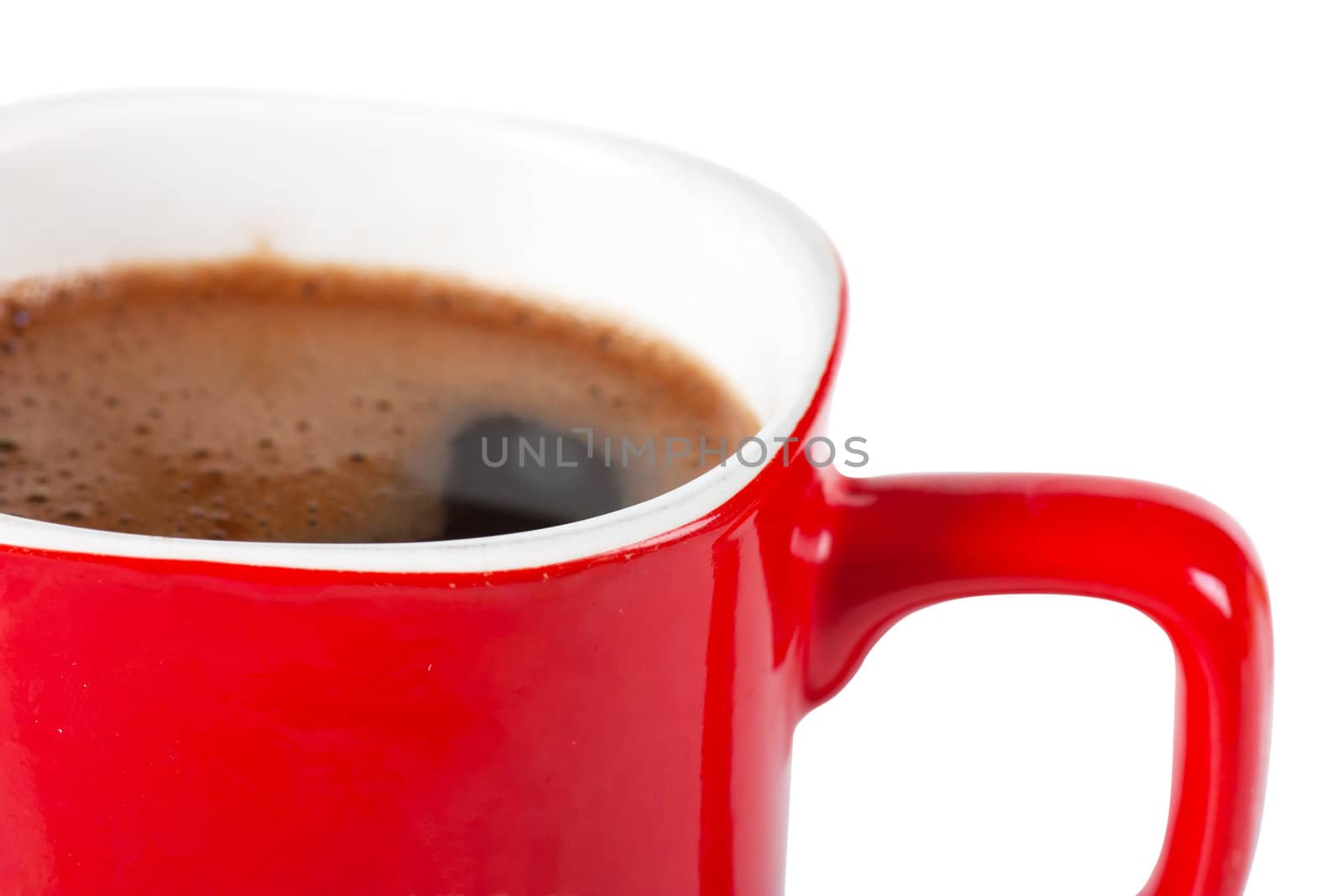 A red cup of coffee isolated over white background