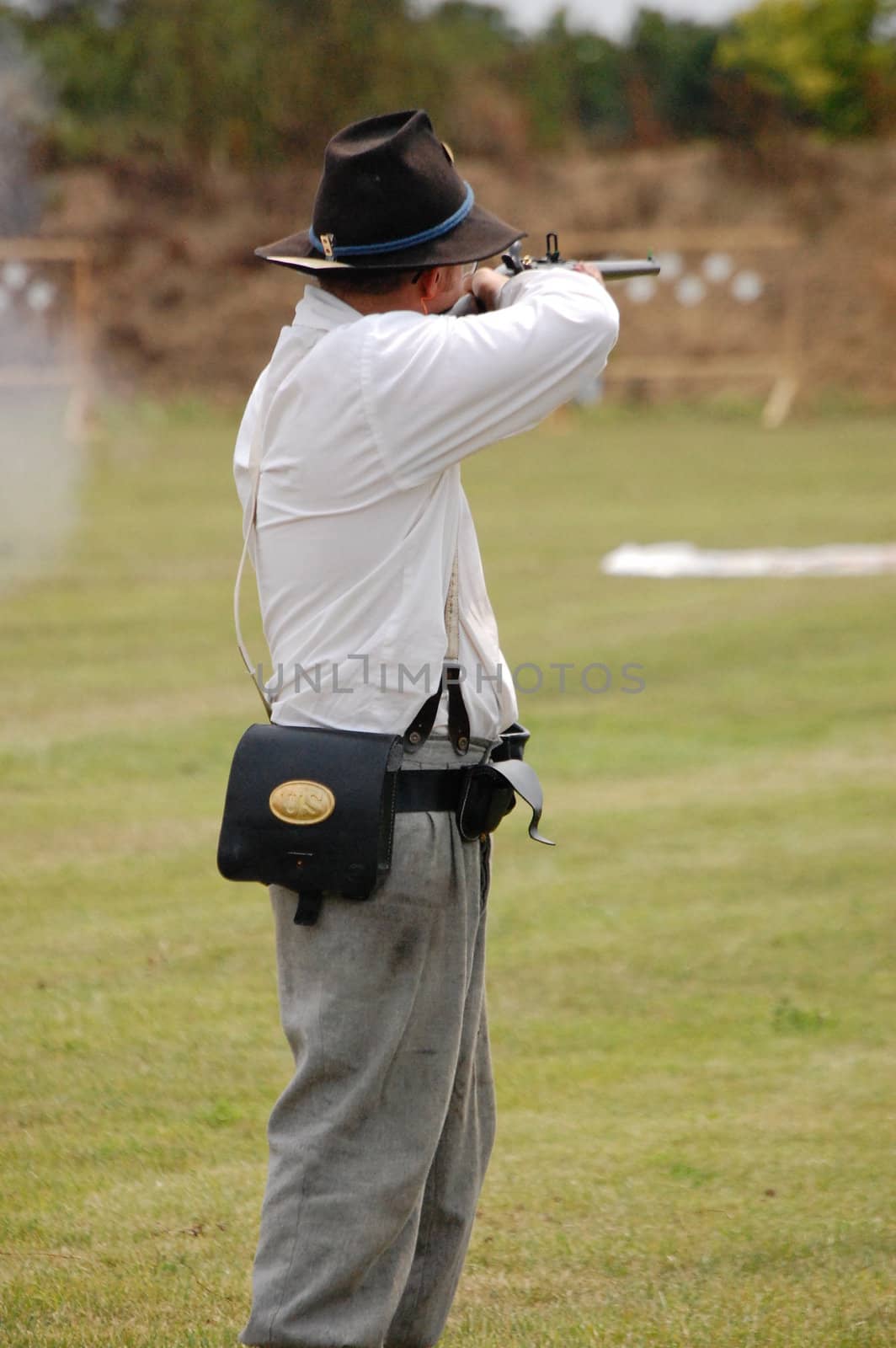 Man aims carbine by RefocusPhoto