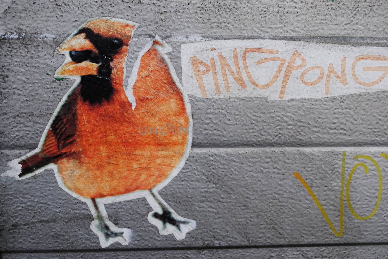 A street art sticker of a bird.