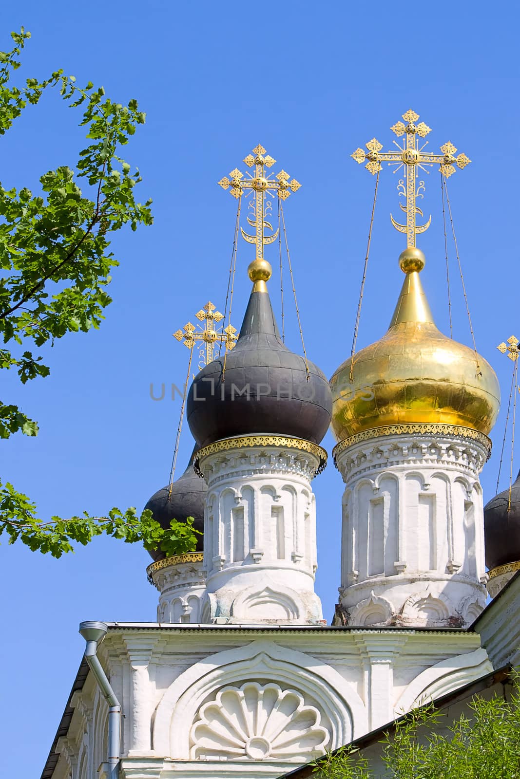 Domes of  orthodox church against  blue sky, Russia.