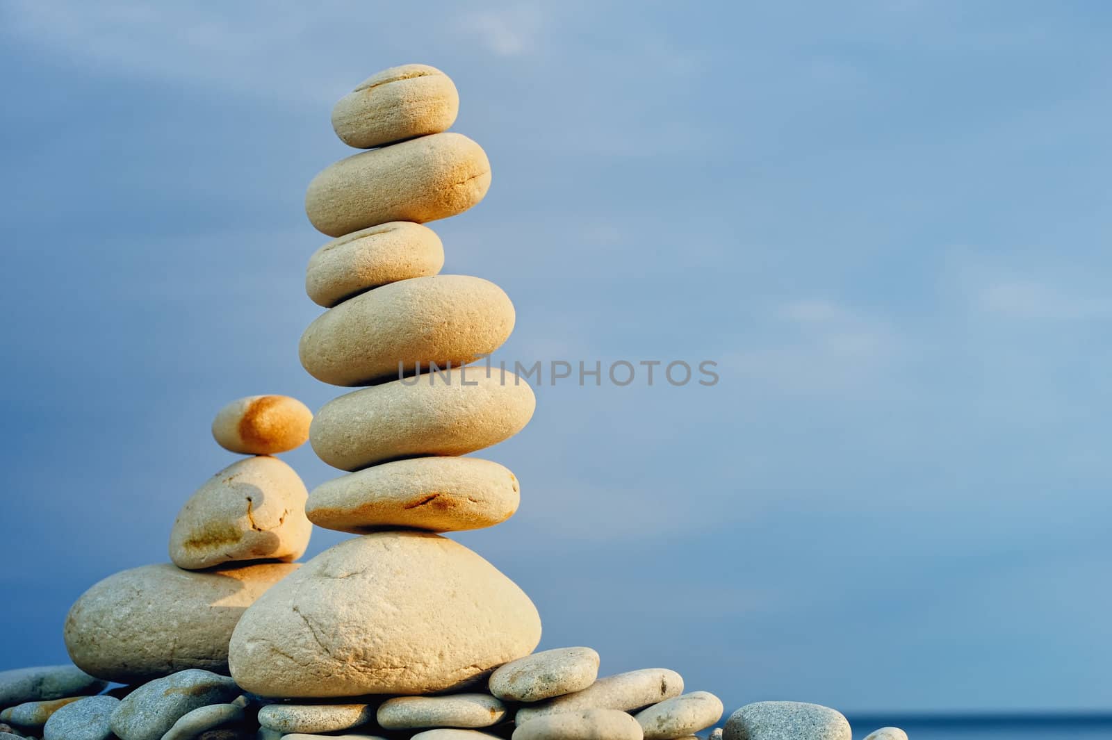 White Stack of zen stones on a sky background