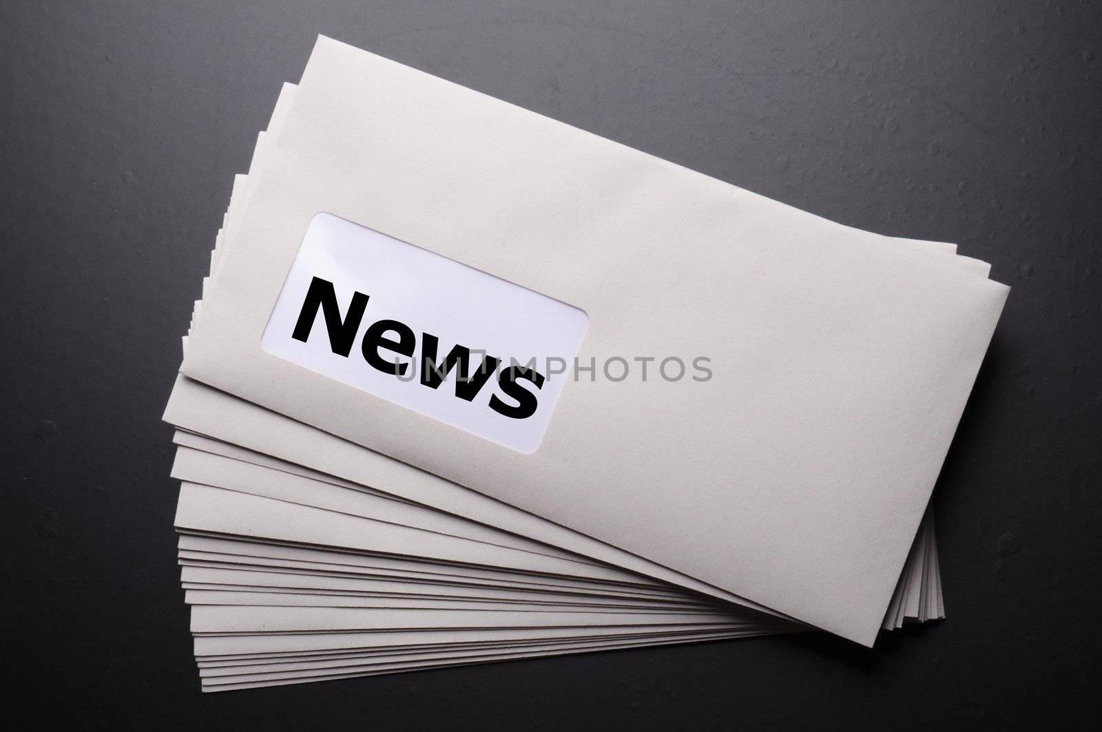 new or newsletter concept with envelope and word
