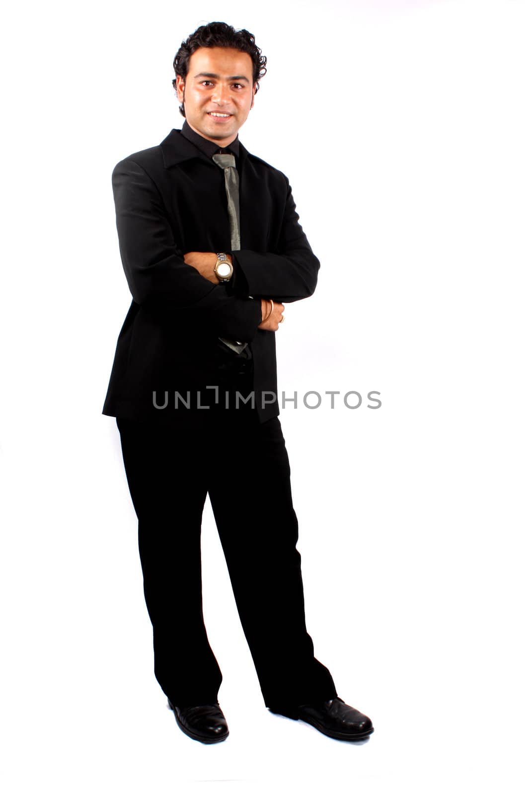 A young Indian businessman, isolated on white studio background.