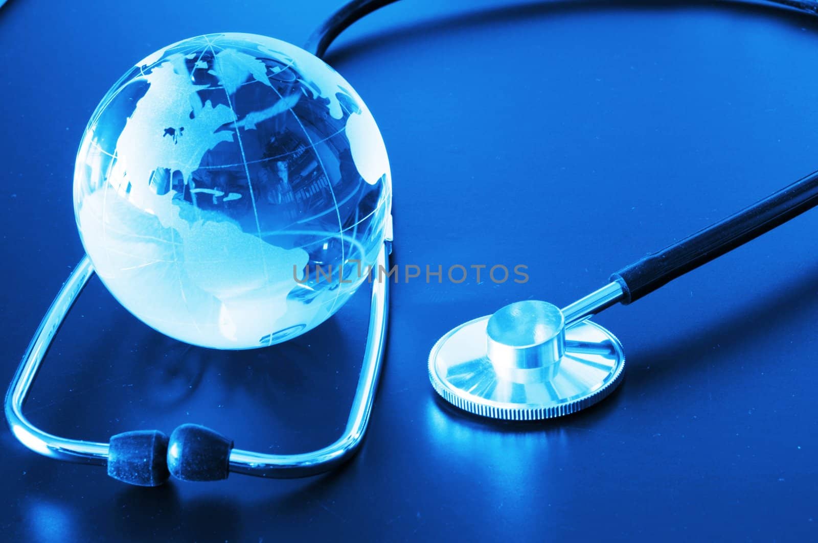 ecology eco environment or global warming concept with glass globe and stethoscope