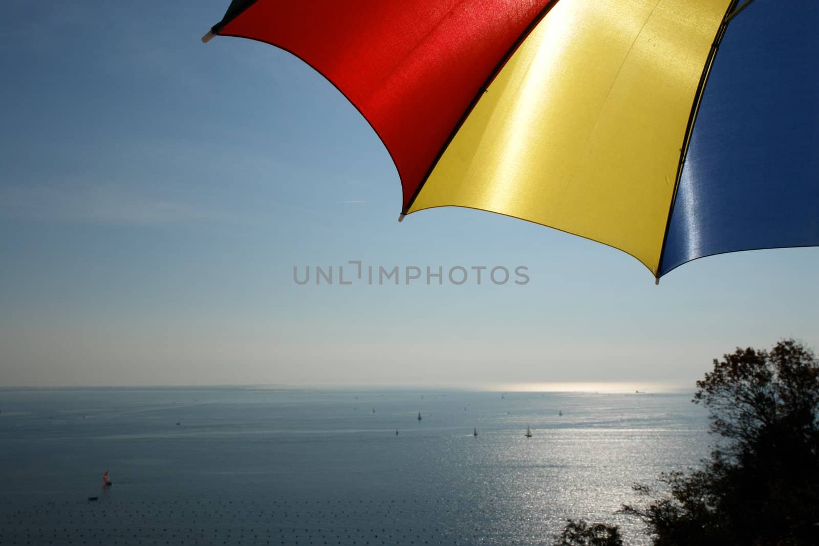 colorful parasol at the ocean on a sunny day