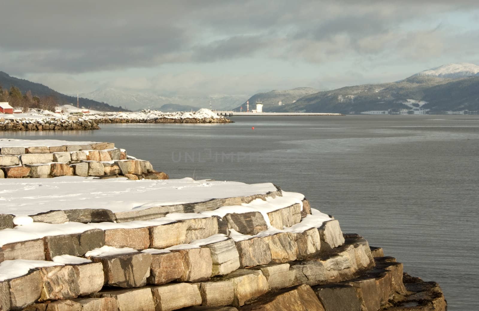 Snow covered coast line with air port in the background, Molde, Norway