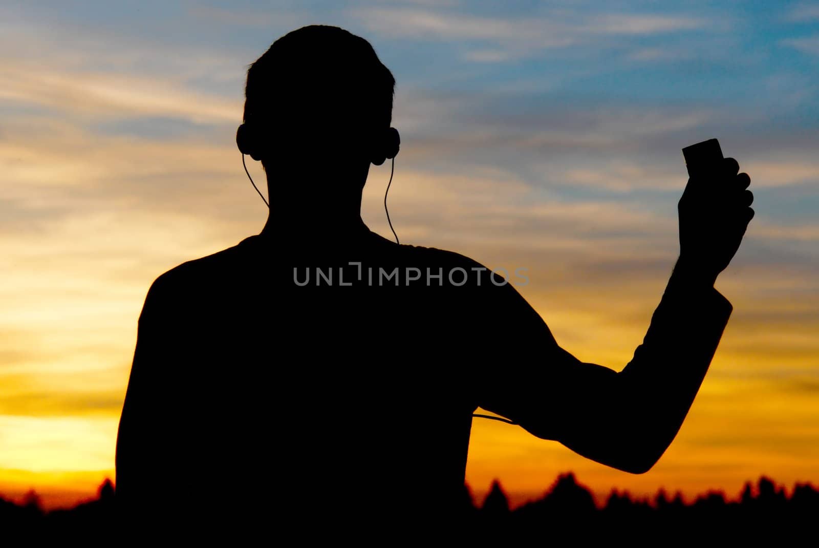 A person listening to the music again sunset