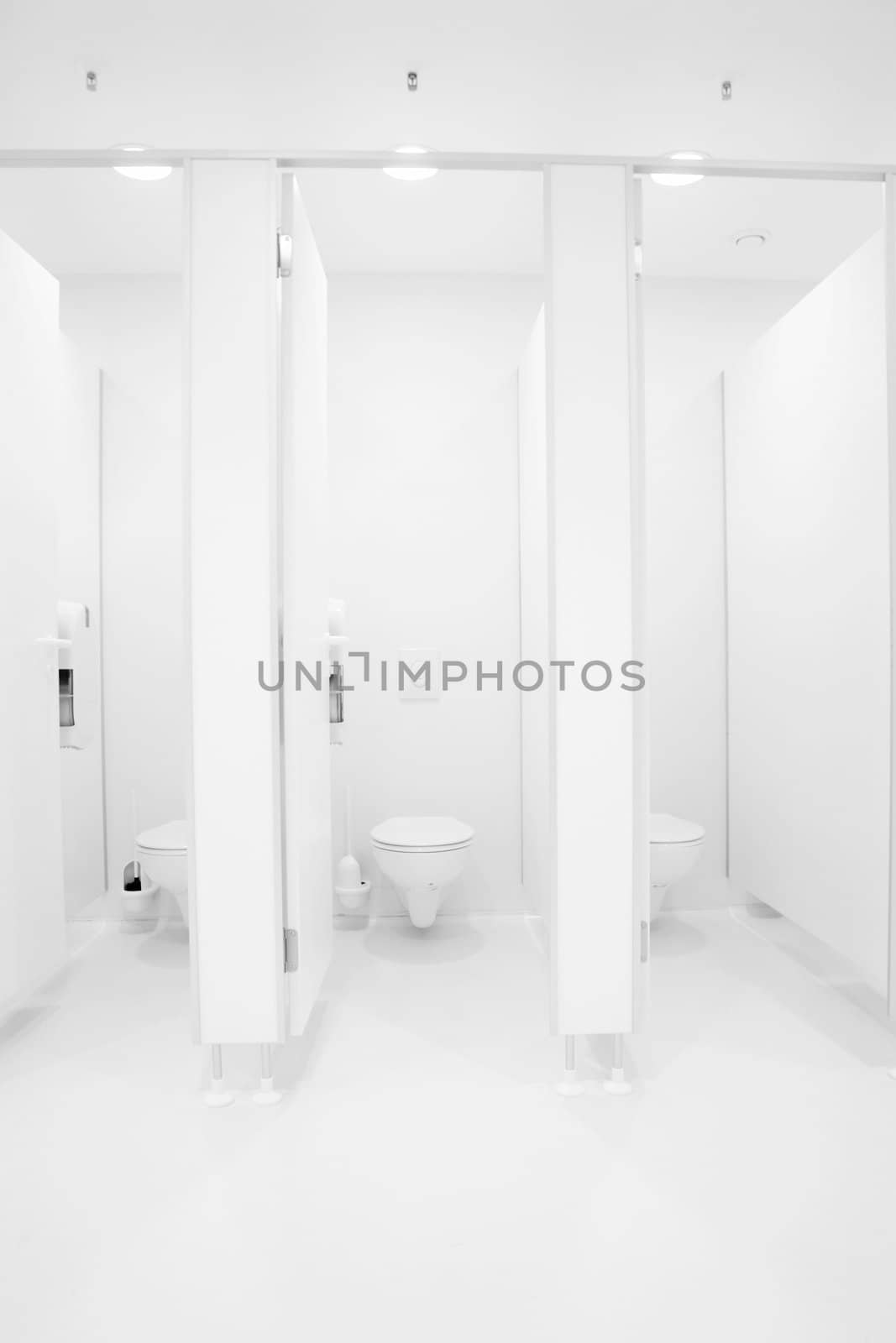 a clean new public toilet room empty