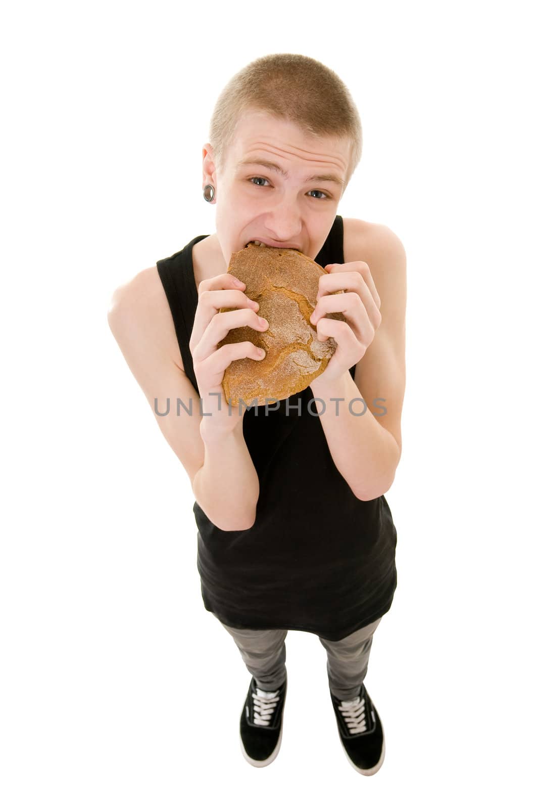 The hungry teenager eating a bread isolated on white background