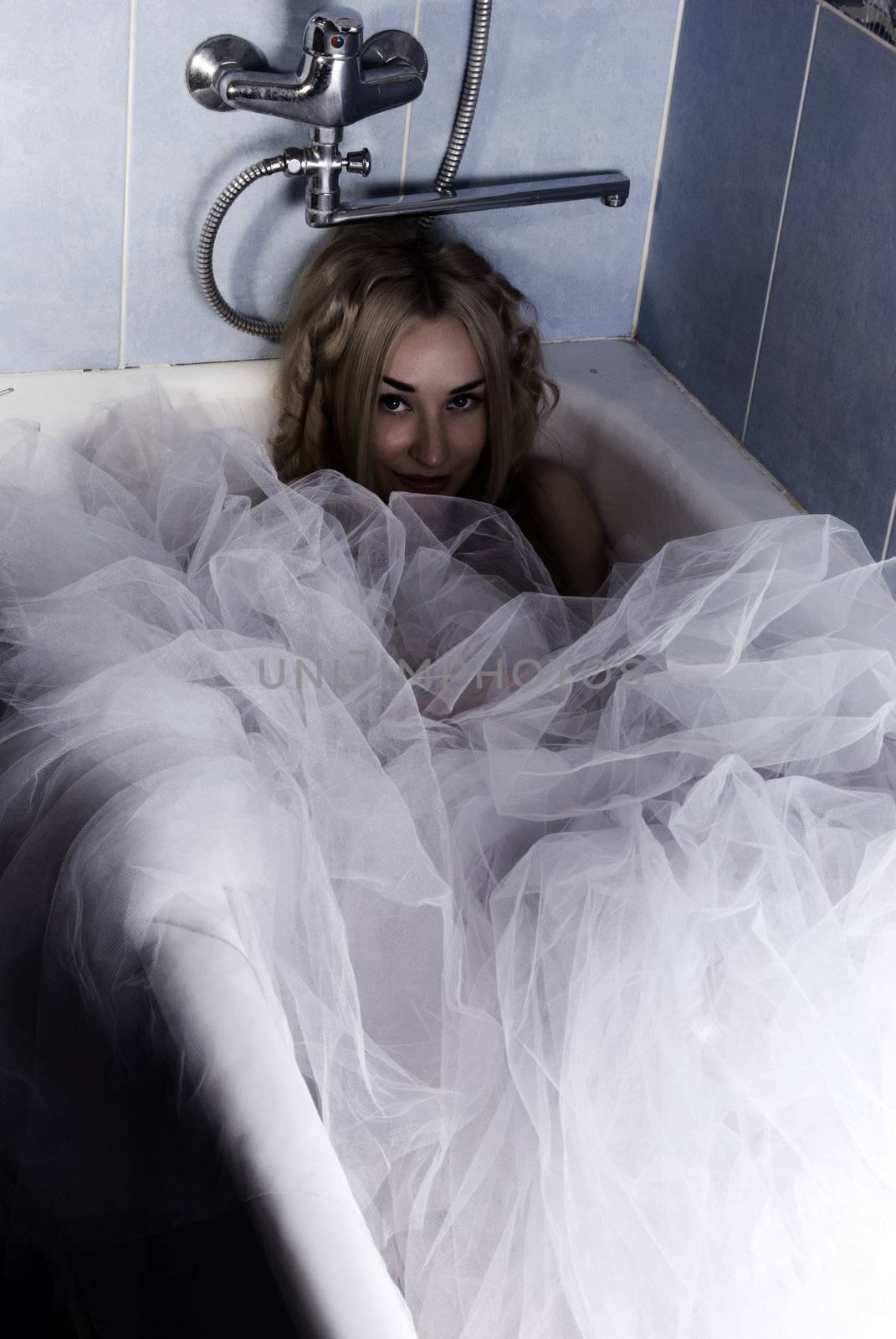  young bride posing in bathroom 