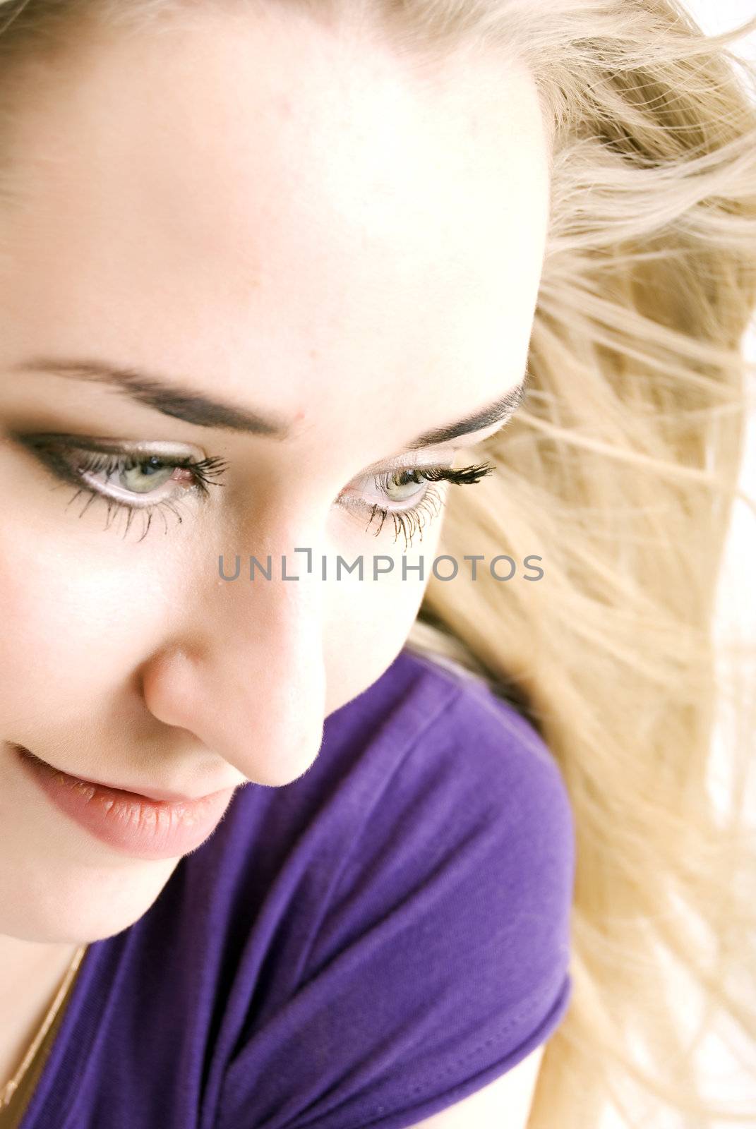  Portrait of a young seductive blonde close-up