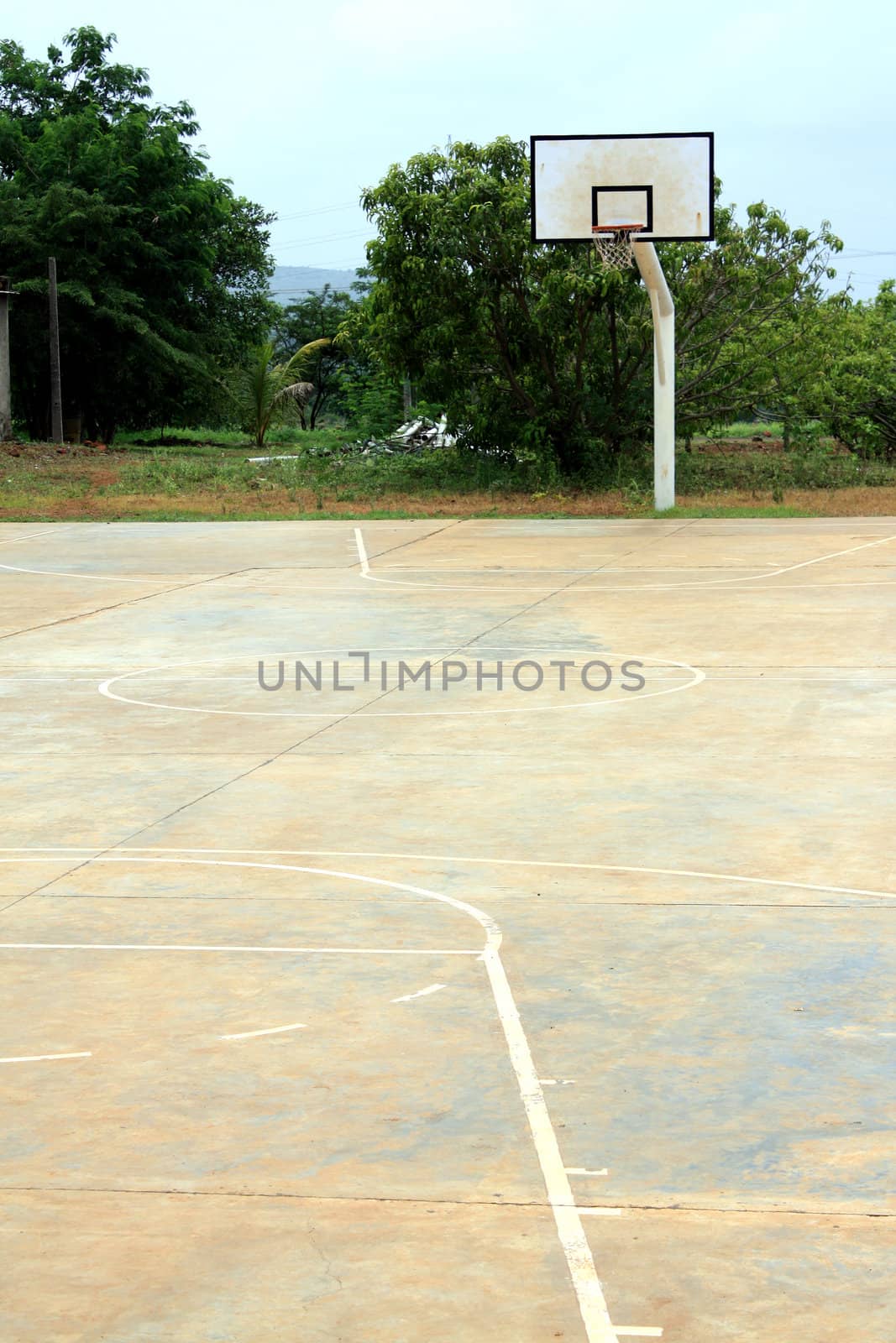 An empty basketball court in a school.