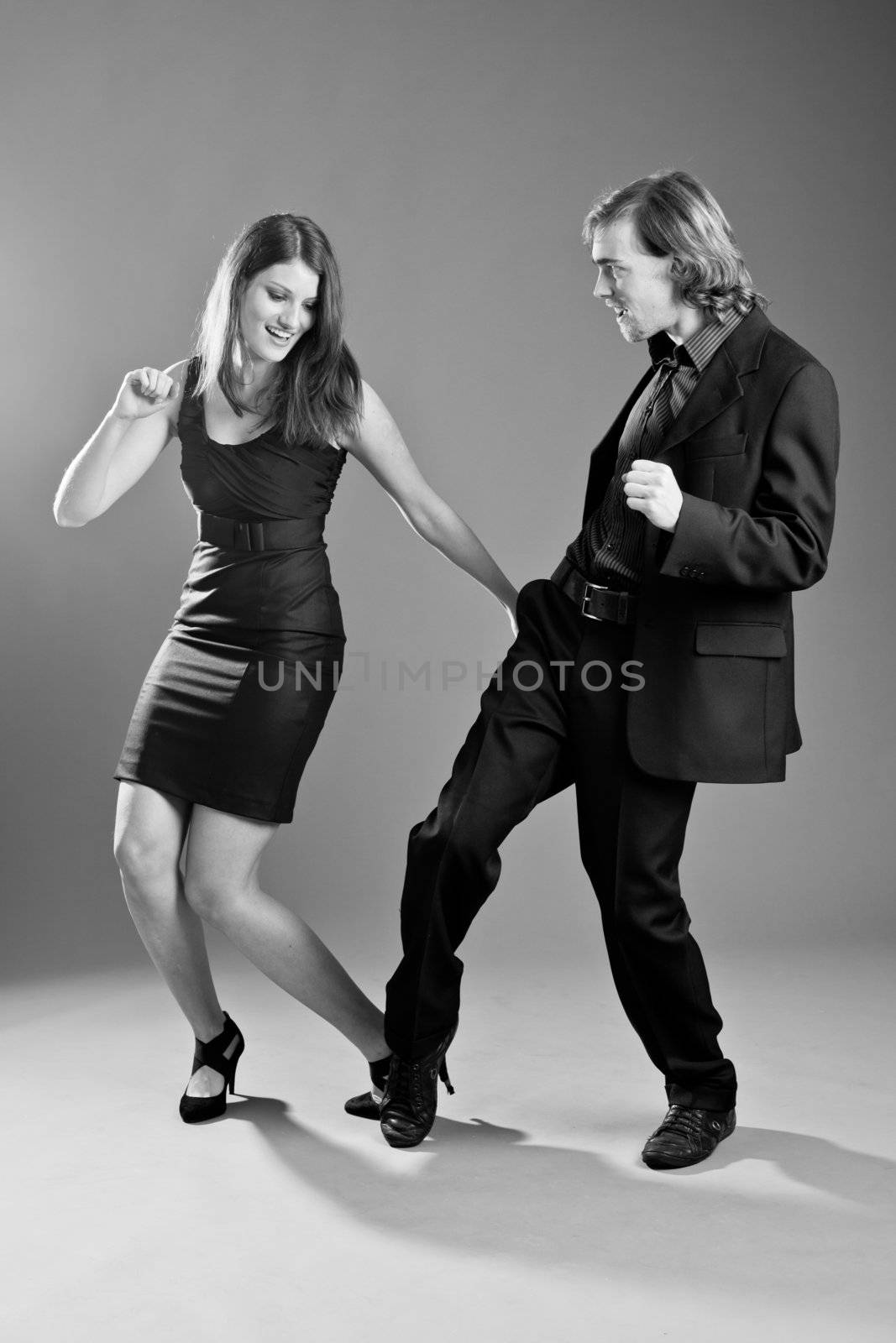 Handsome young couple having a good time dancing together