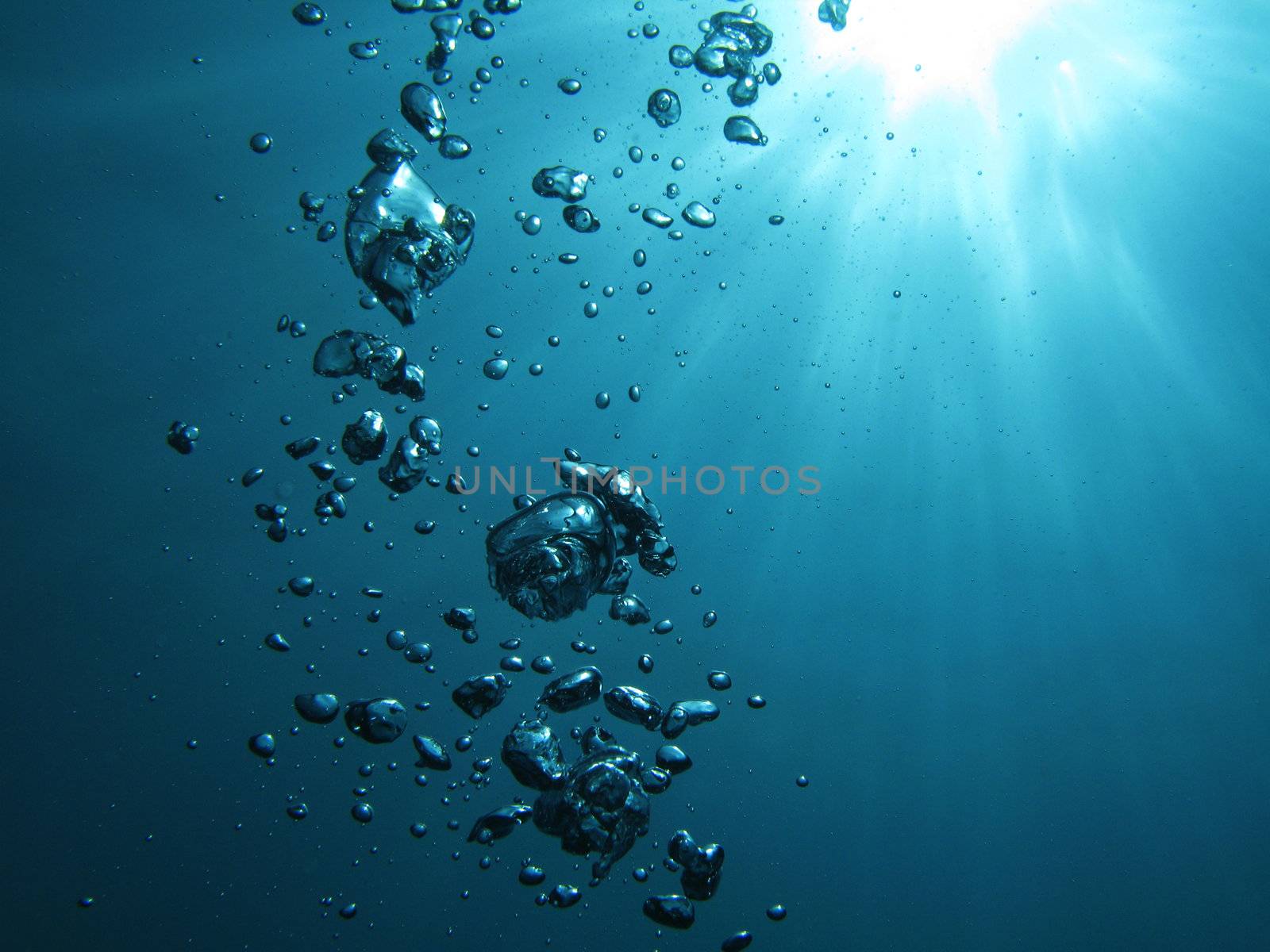 Bubbles undersea and sun.