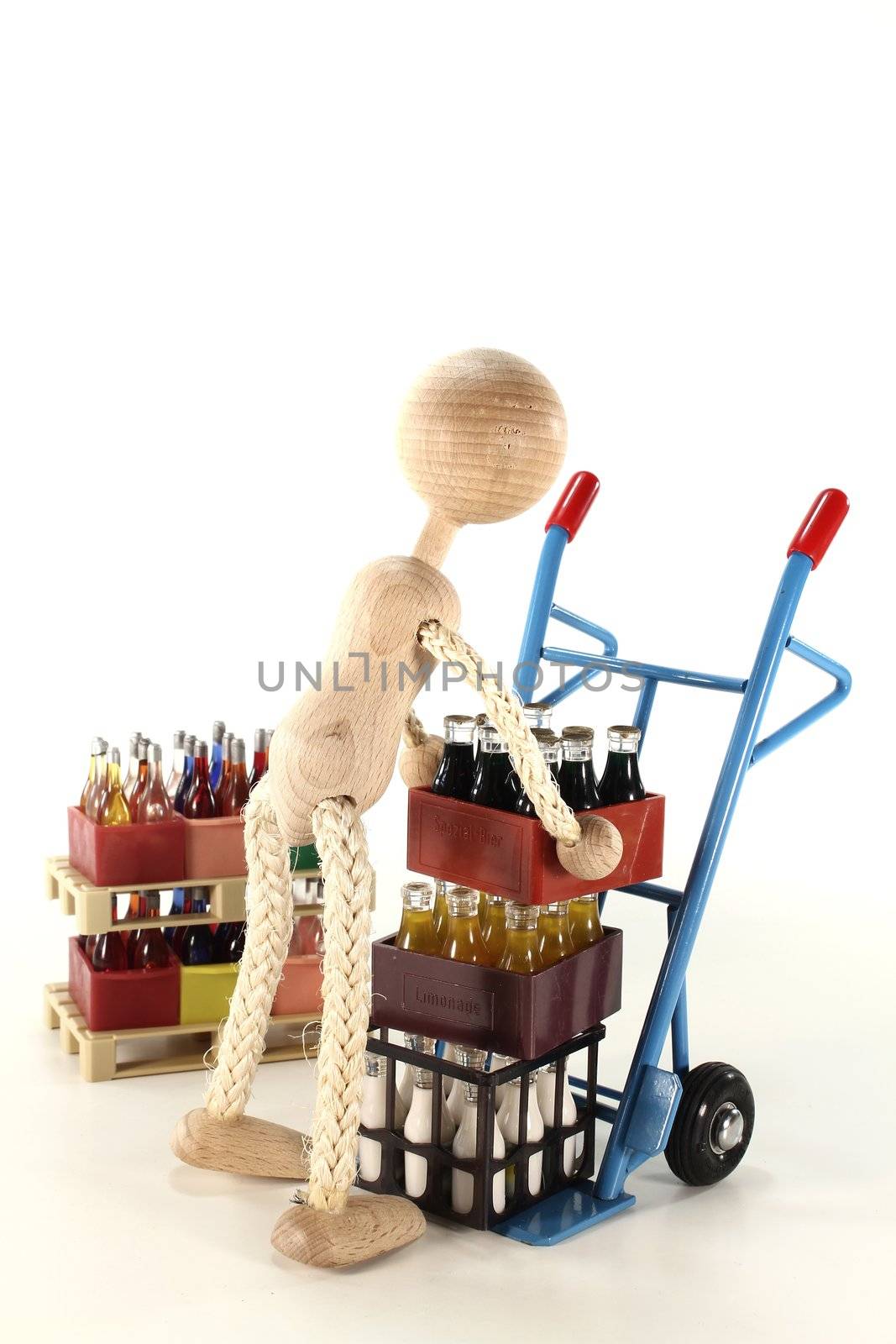 doll loads sack truck with cola, lemonade, milk and beverages stacked on euro pallets in the background