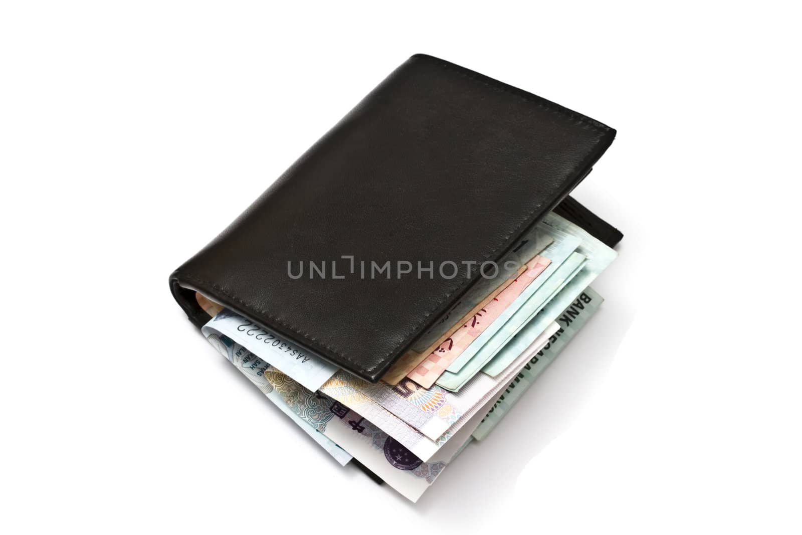 Wallet and various currency isolated on white background