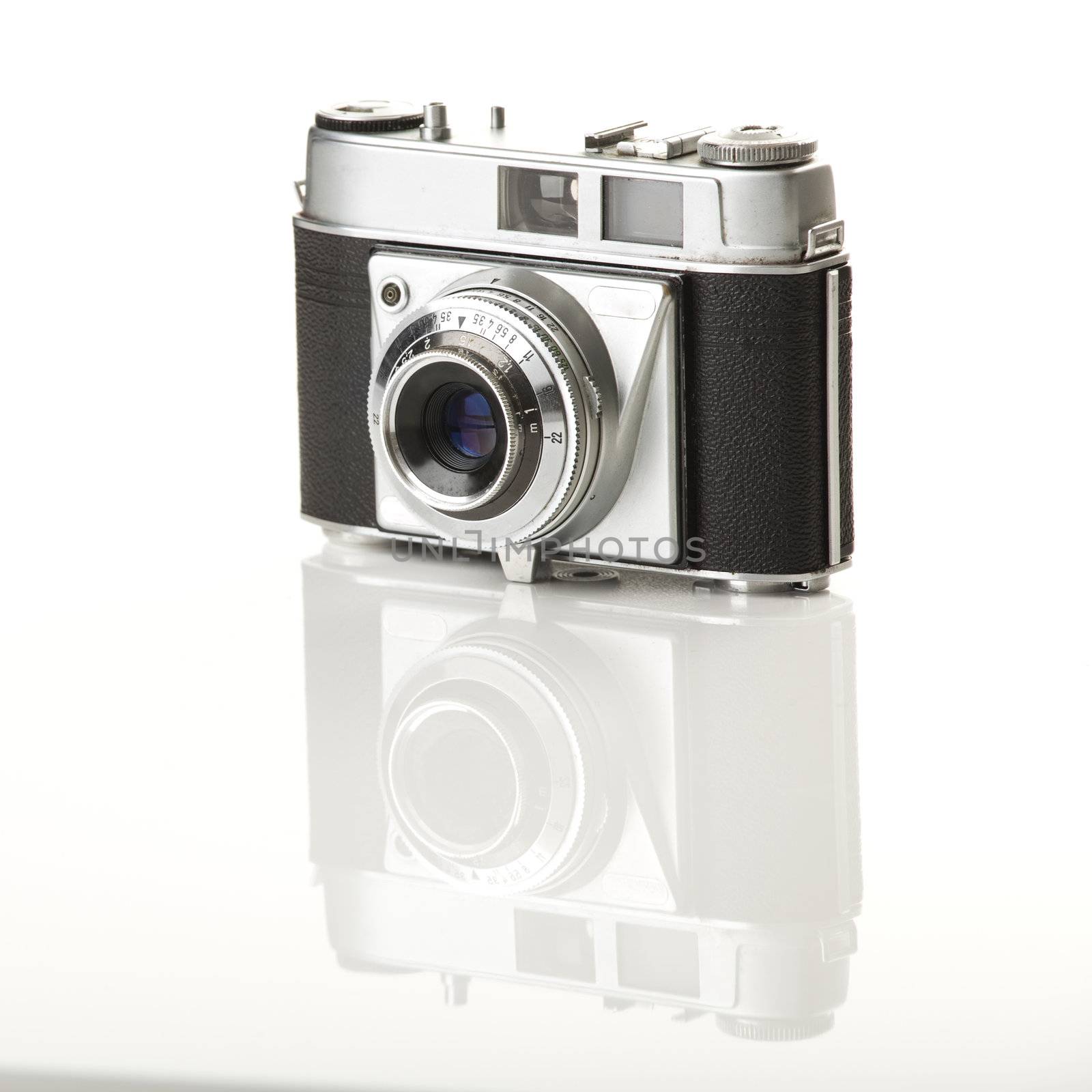 Old fashioned photography camera isolated over a white background