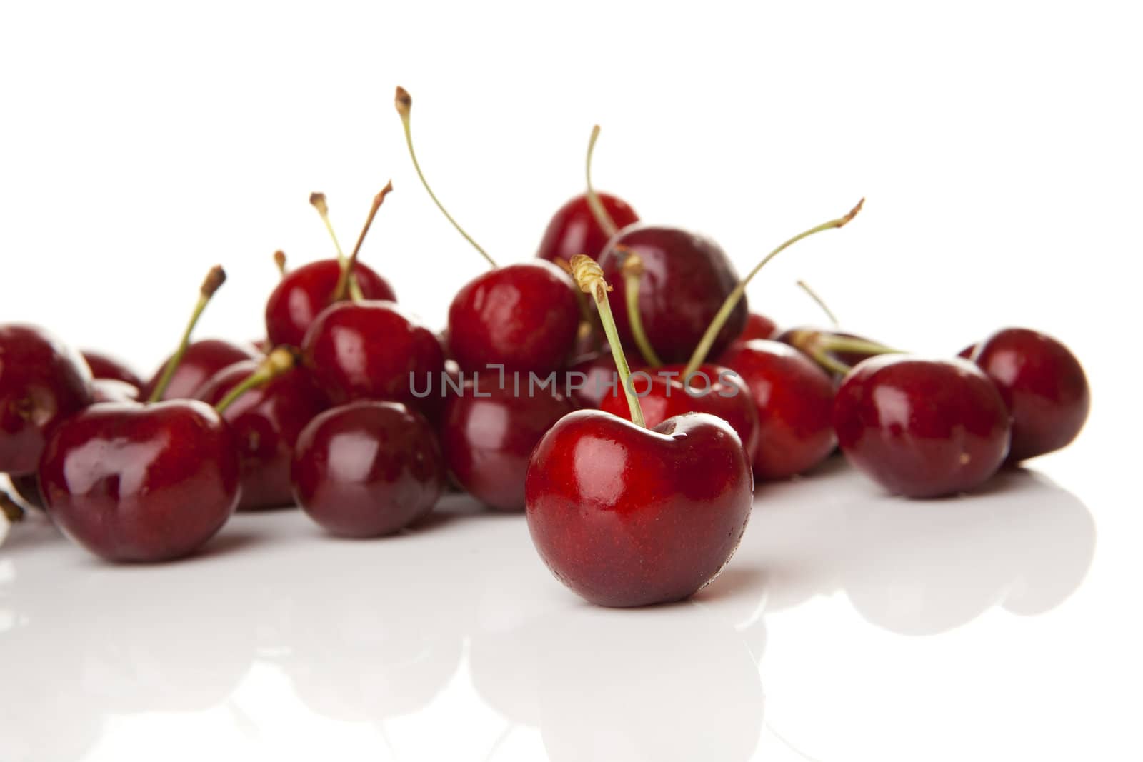 Red Cherries isolated over a white background