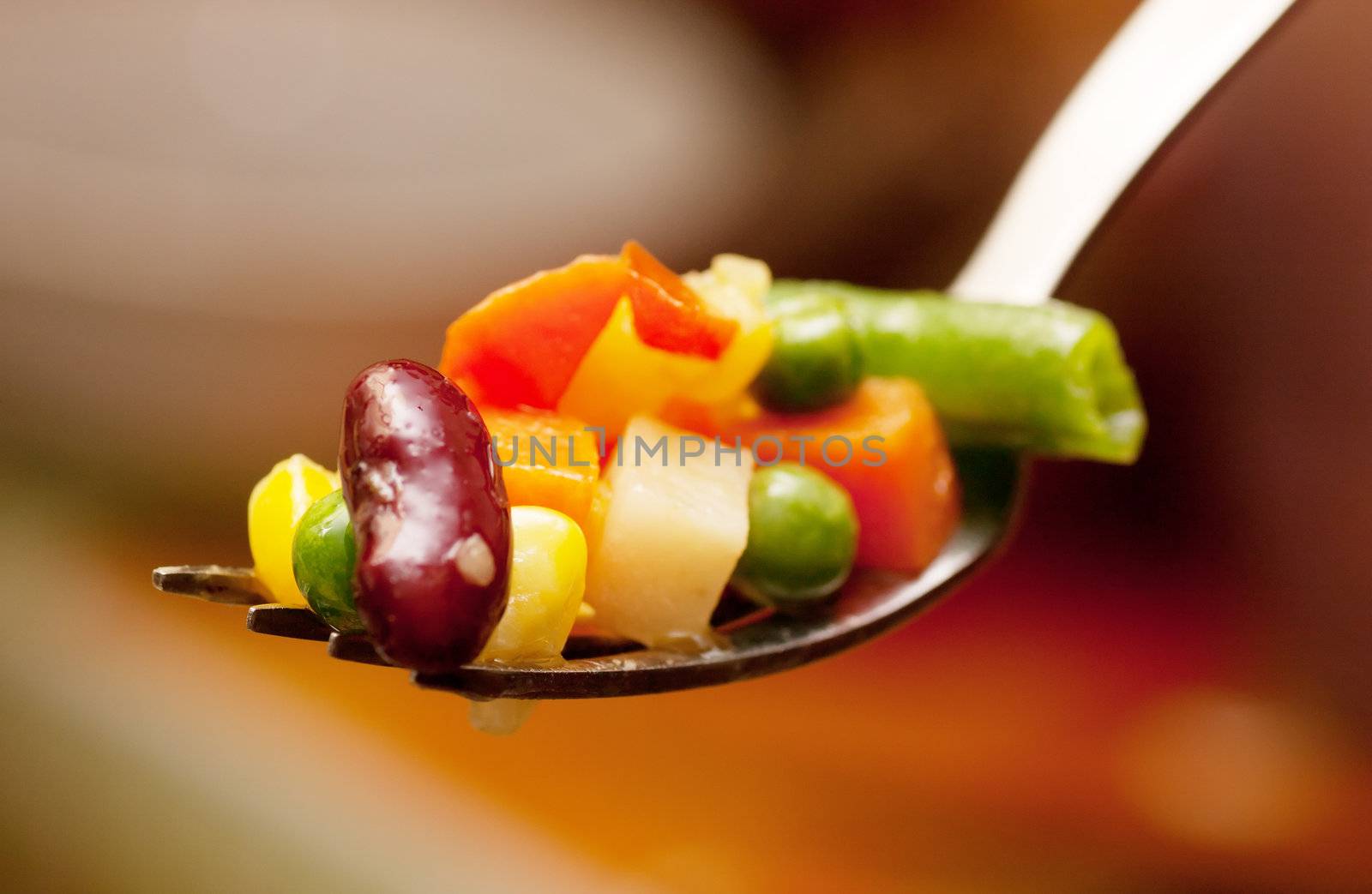 Pieces of boiled vegetables on a fork