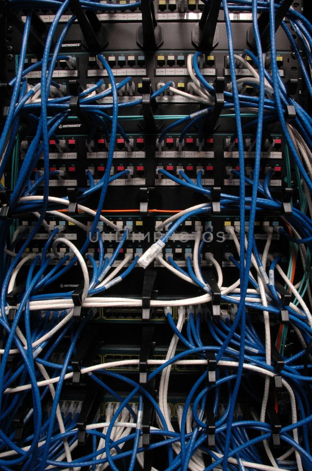 Banks of wires connecting servers, telephones and other digital systems
