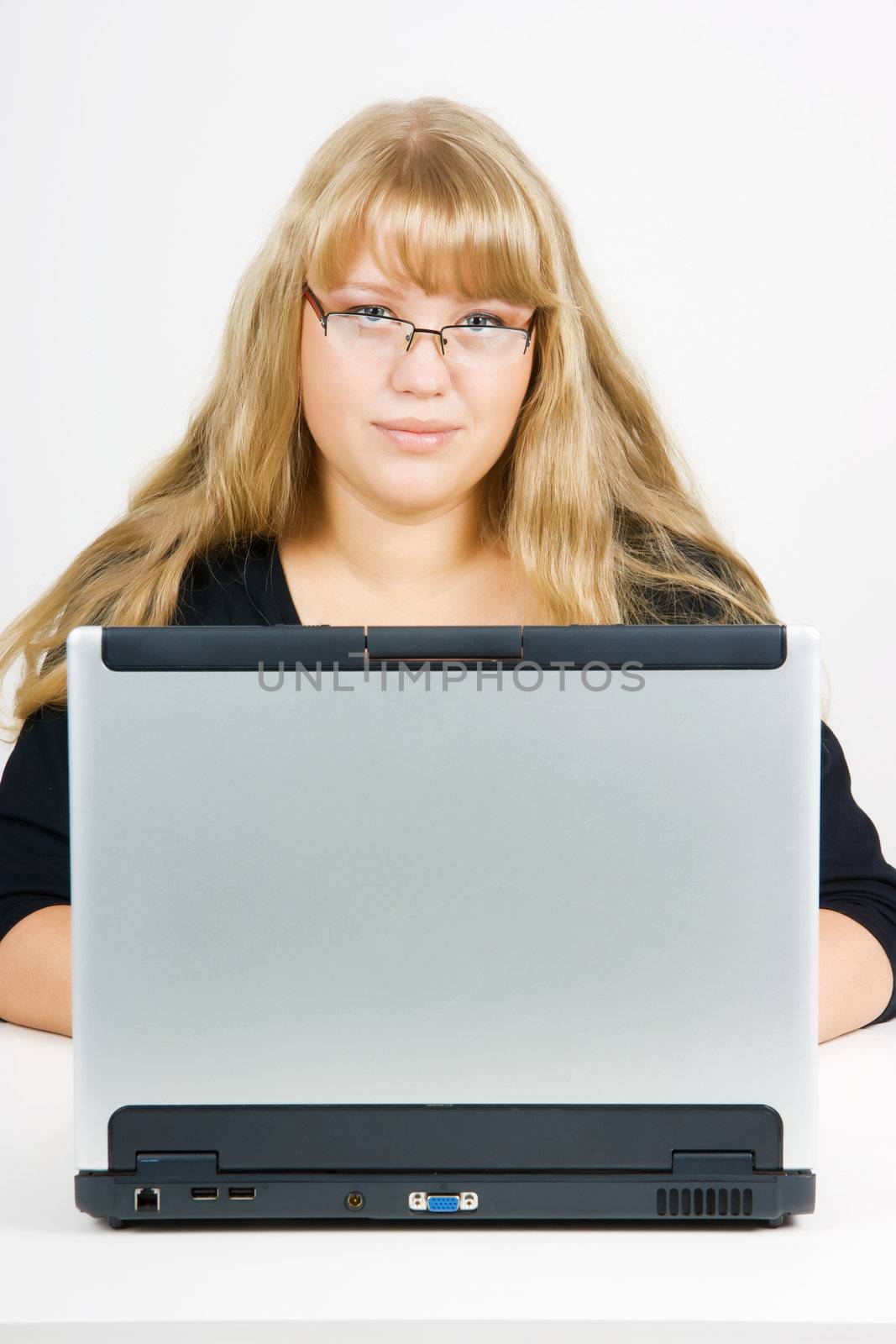 blonde with long beautiful hair with a laptop