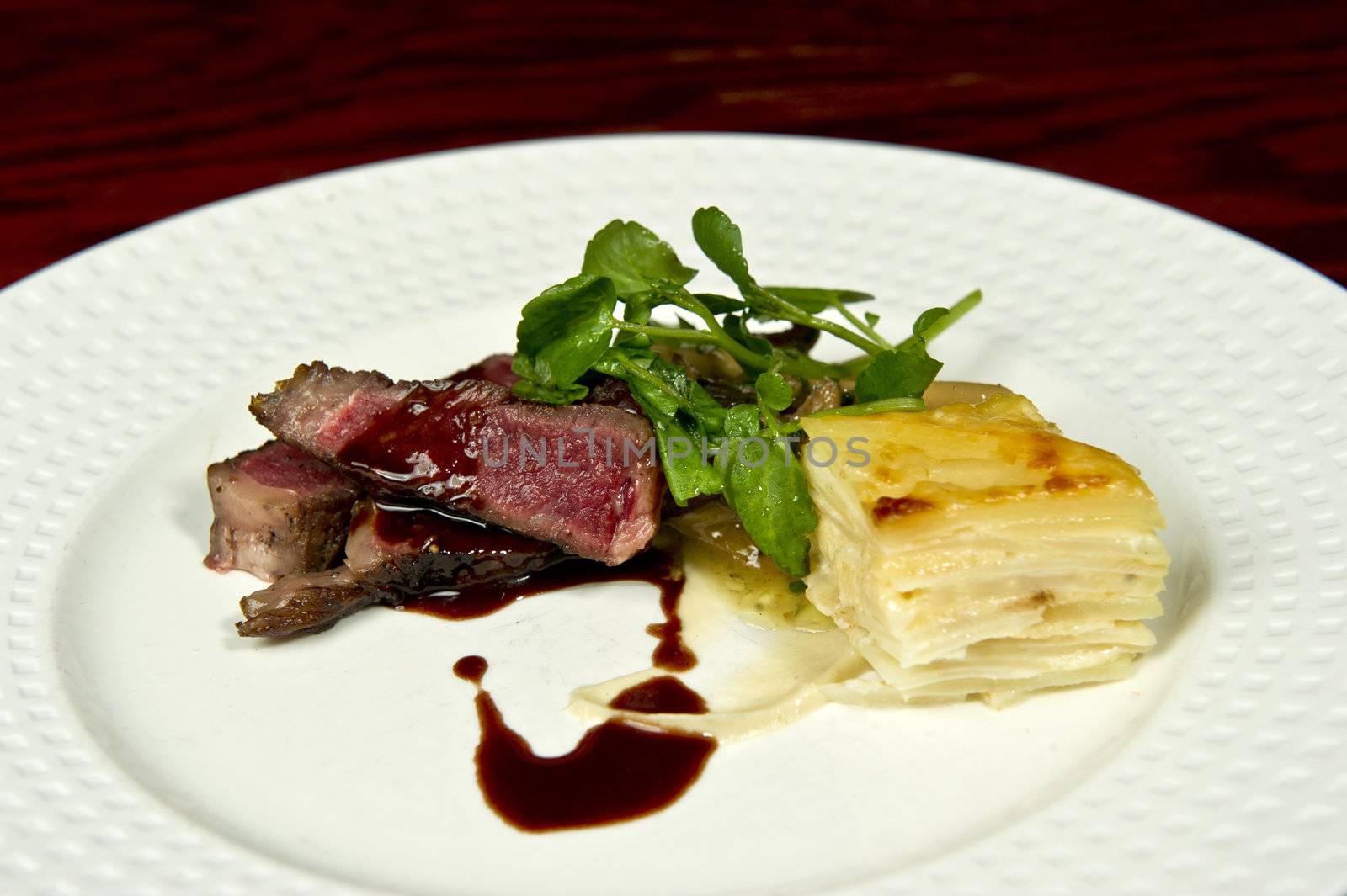Image of a gourmet steak and potato dish