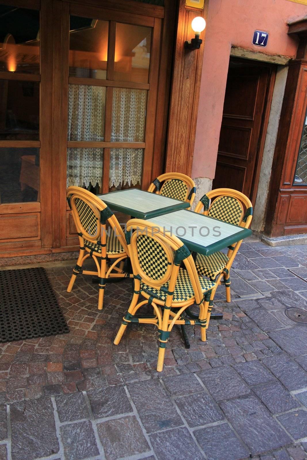Tables and chairs in the street of old city of Annecy, France