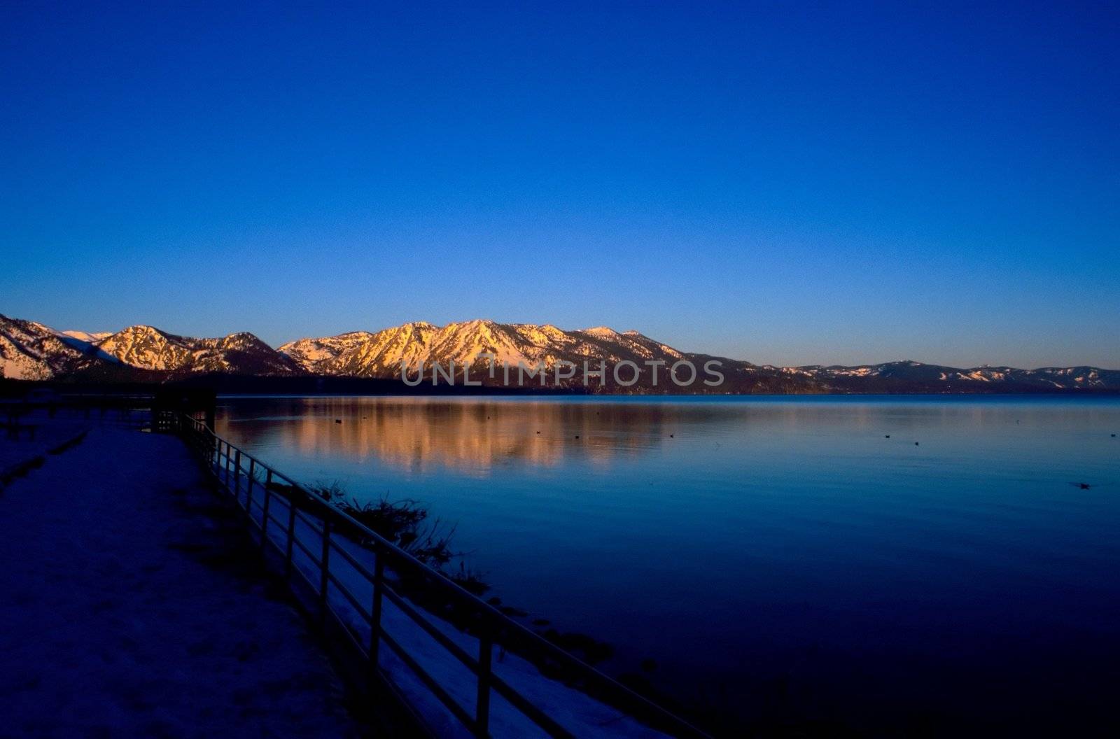 Lake Tahoe is a large freshwater lake in the Sierra Nevada mountains of the United States. It is located along the border between California and Nevada, west of Carson City, Nevada. The lake is known for the clarity of its water and the panorama of surrounding mountains on all sides.