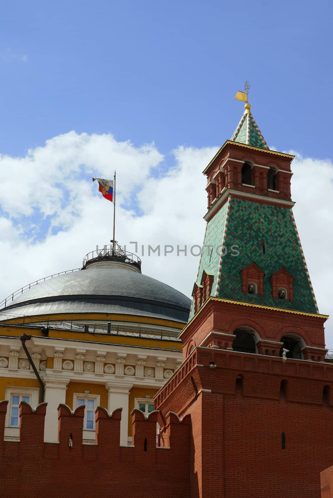 Russian flag over government building behind Kremlin wall