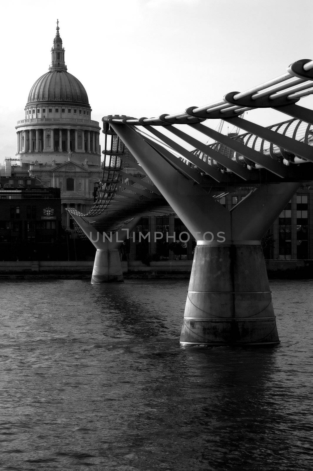 St Pauls Cathedral and Millennium Bridge over the River Thames.