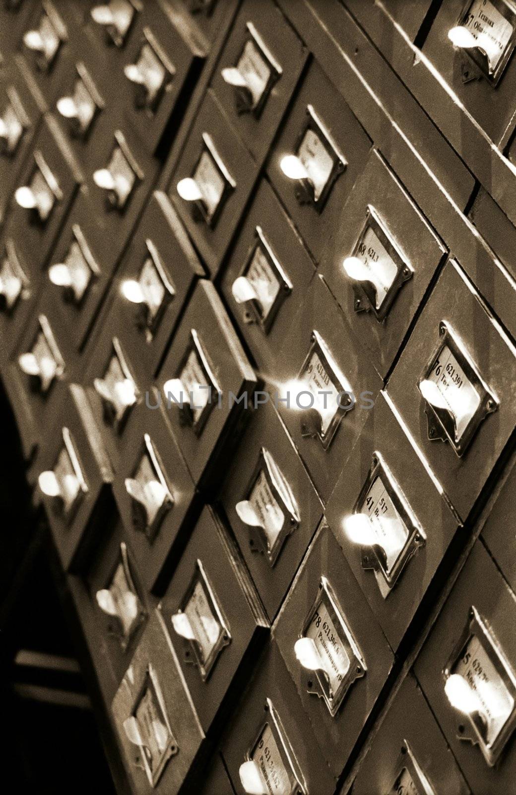 An office drawer in a library with a number of file boxes 