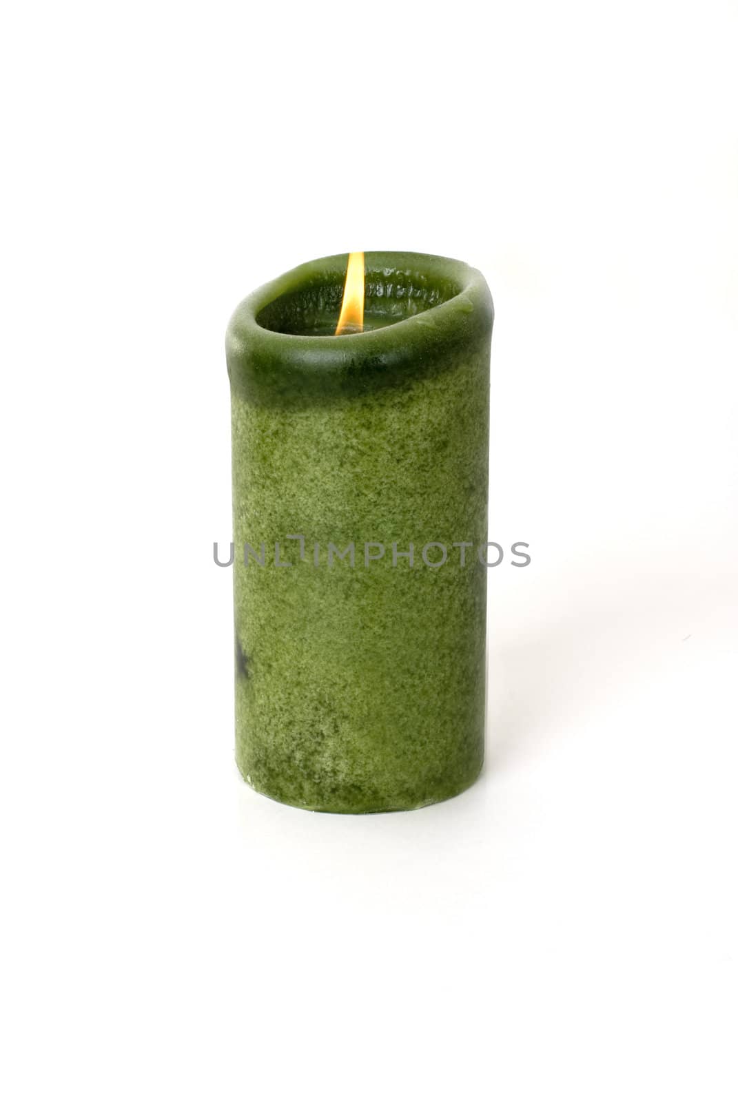 A green candle on a white background.