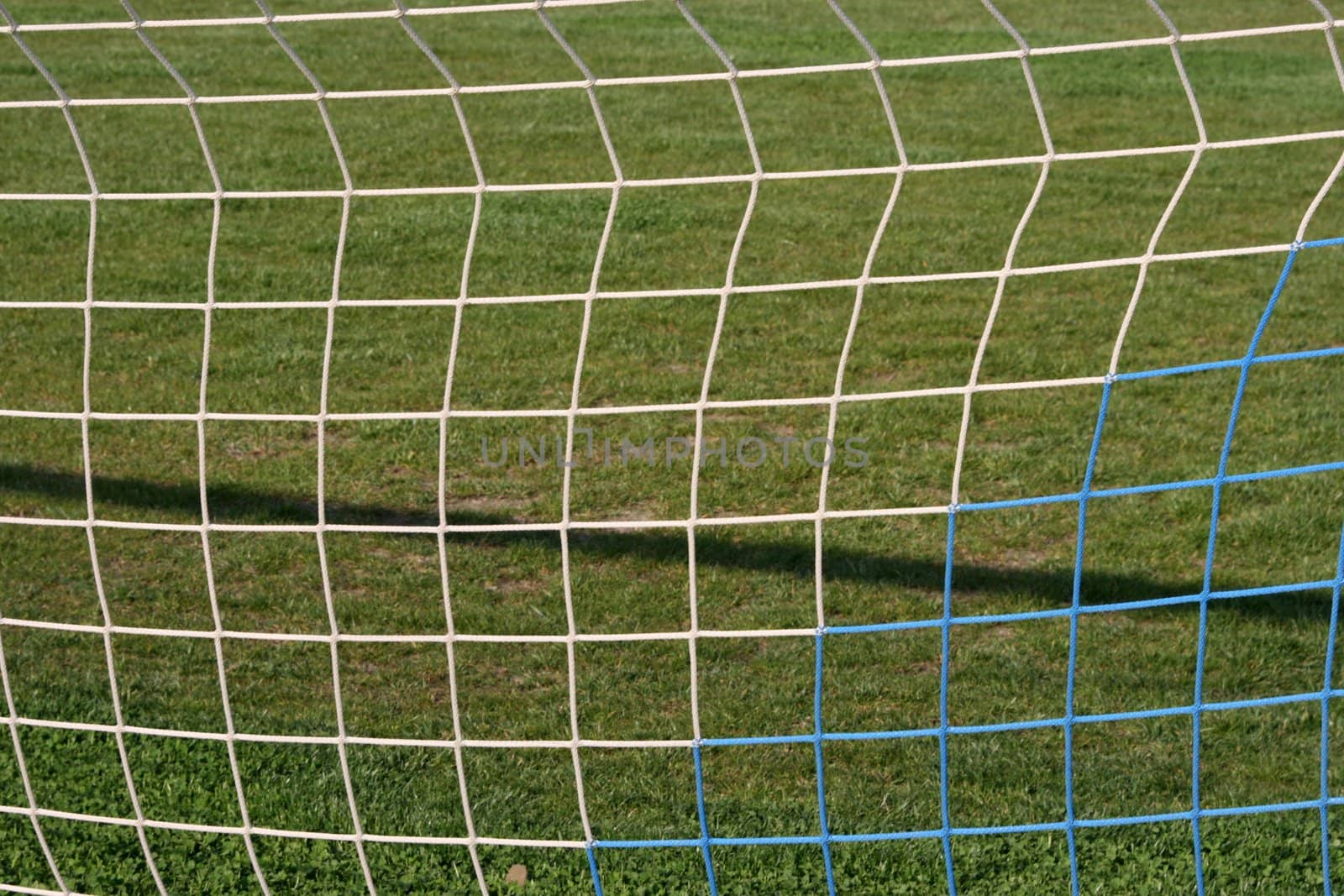 goalpost net detail with green grass  background sports concepts