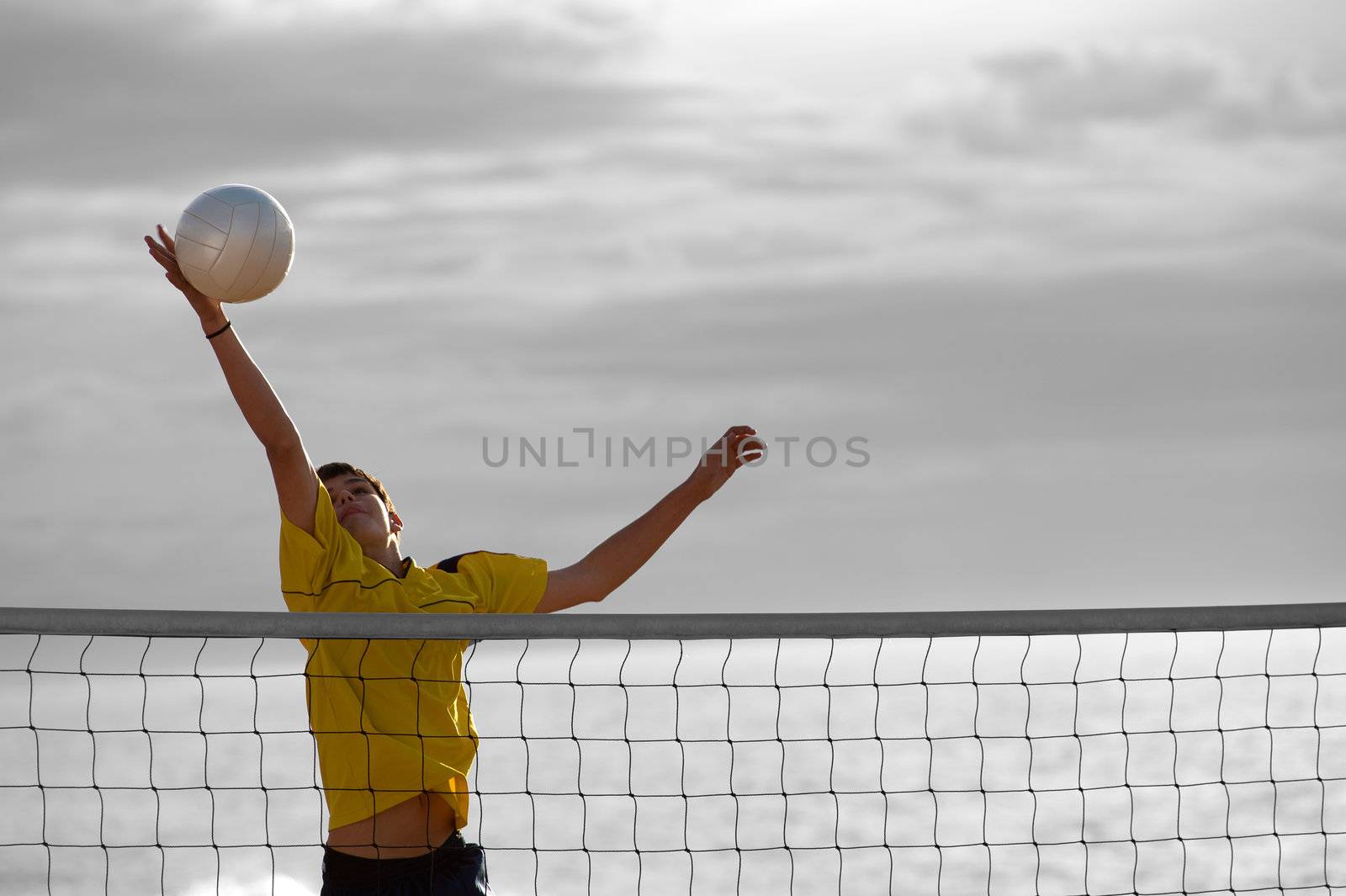 Teenager in action during a match of beach volley