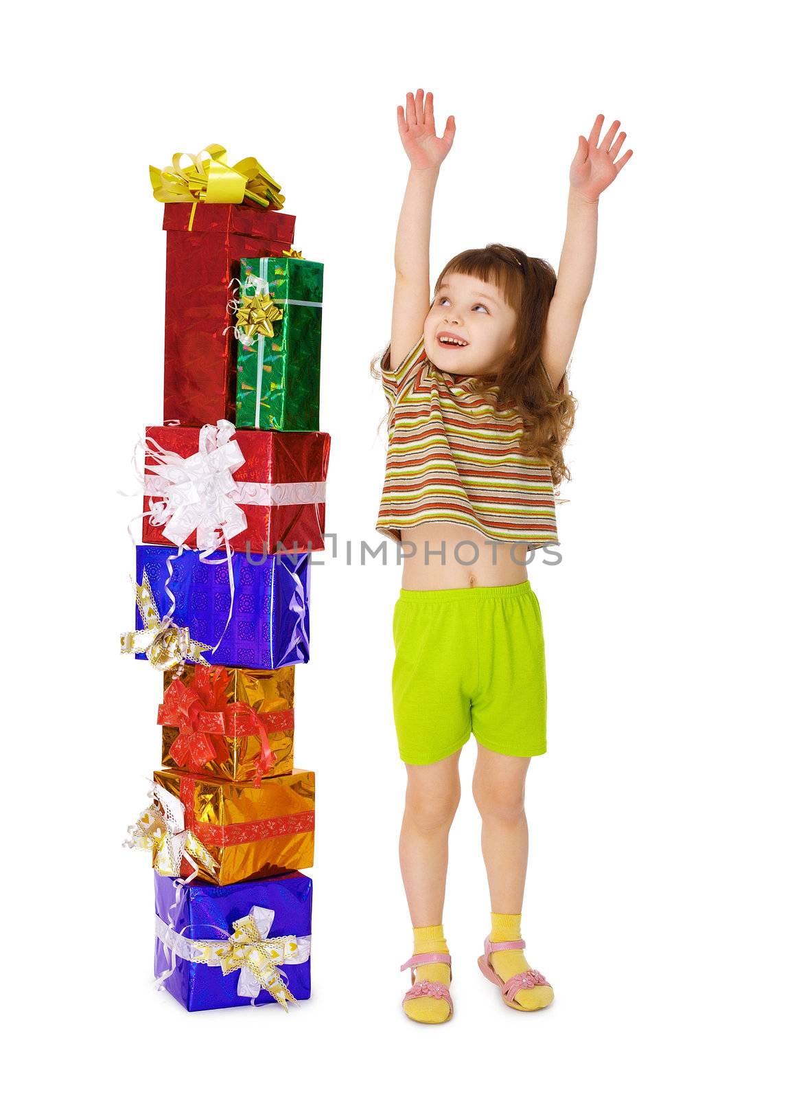 A child enjoys a lot of gifts for his birthday isolated on white background