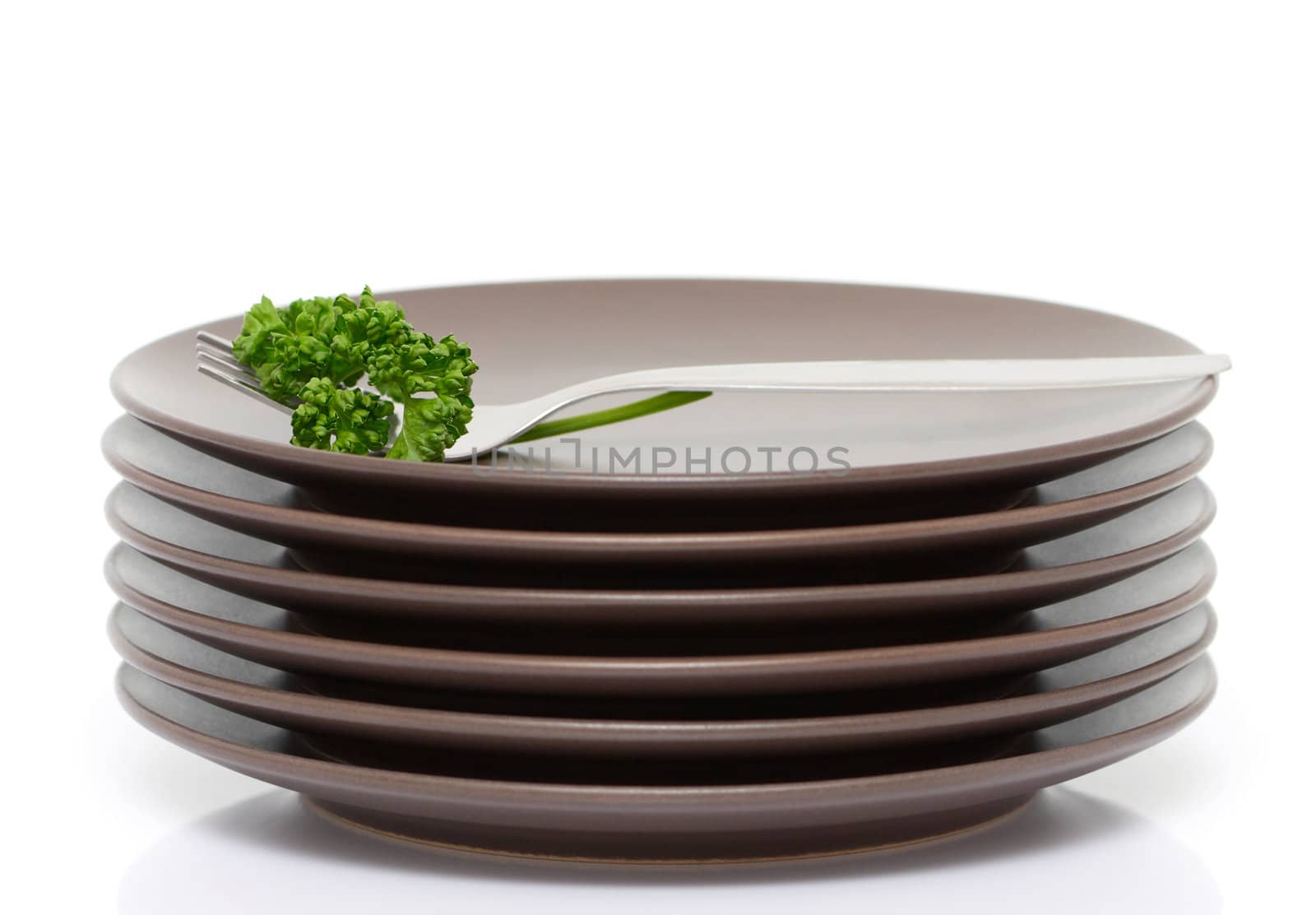 Plates, fork and parsley by Olinkau