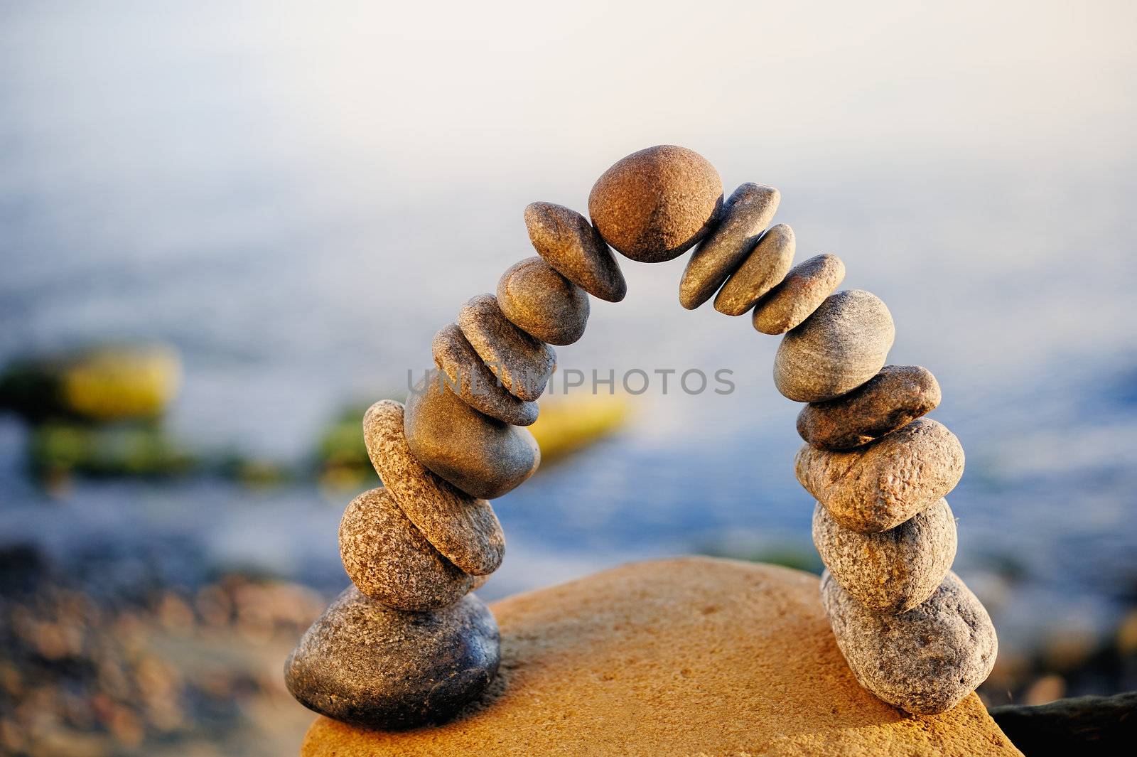 Pebbles stacked one on top of another as arch