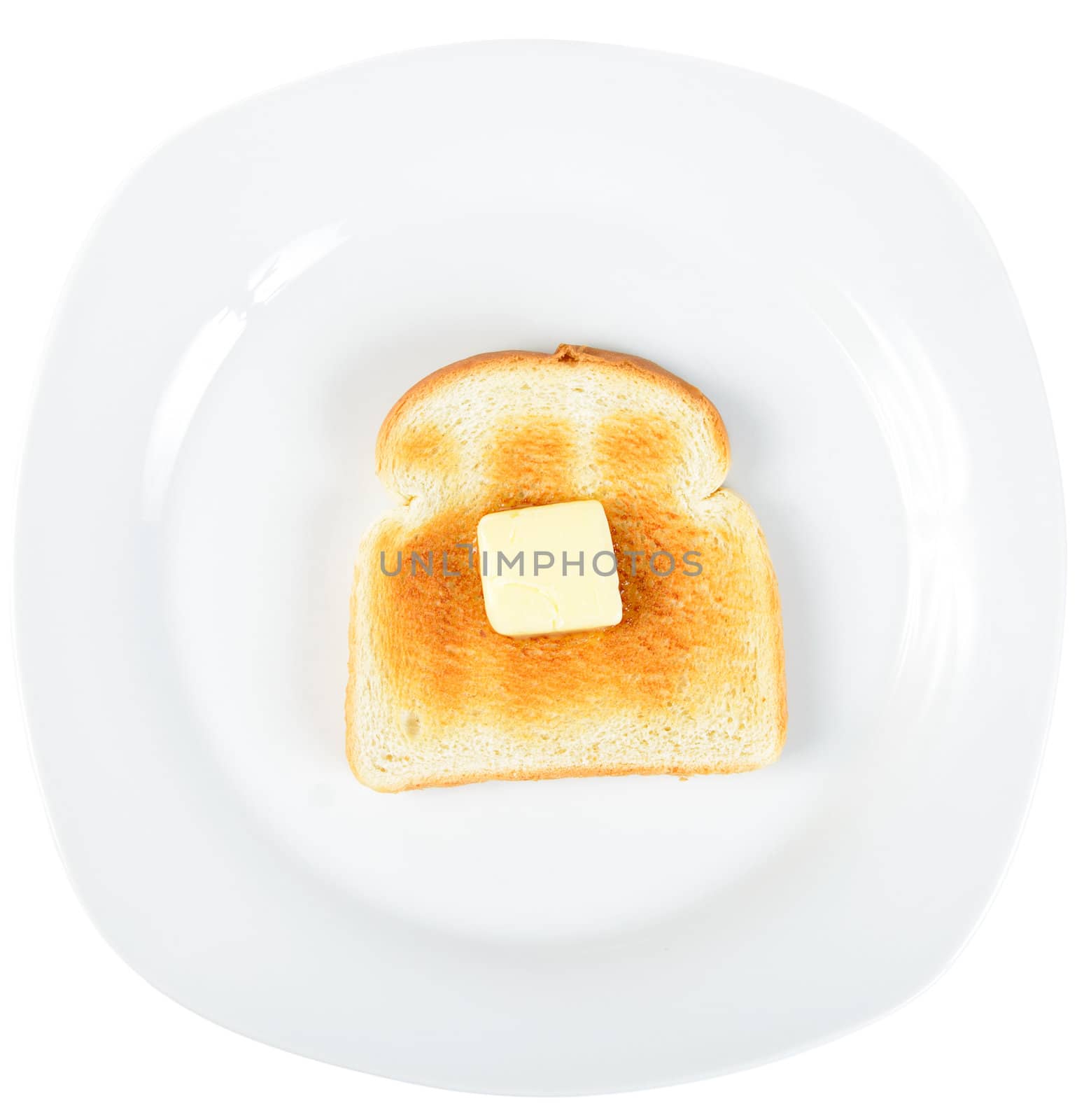 A slice of toast on a white plate with a square of butter slowly melting on top.